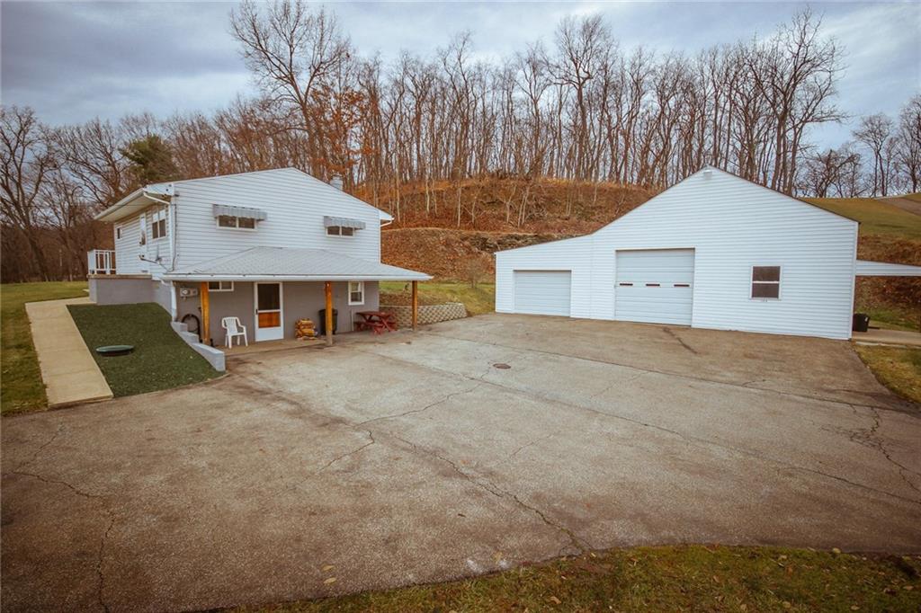 389 Mowry Road Monaca, PA 15061 - Photo 3 of 20 Walk in basement, finished game room, full bath and laundry, over-sized garage and plenty of outdoor space.