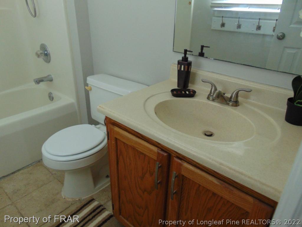 5313 Harding Drive Hope Mills, NC 28348 - Photo 14 of 26 a bathroom with a sink and a toilet