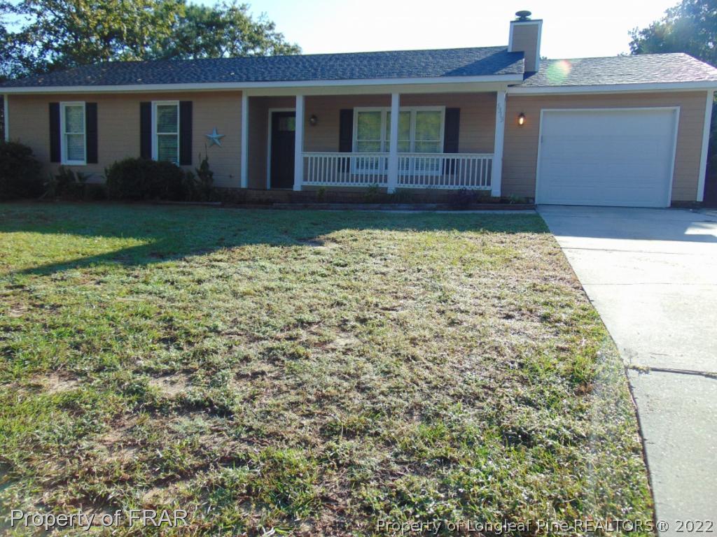 5313 Harding Drive Hope Mills, NC 28348 - Photo 2 of 26 a front view of a house with garden