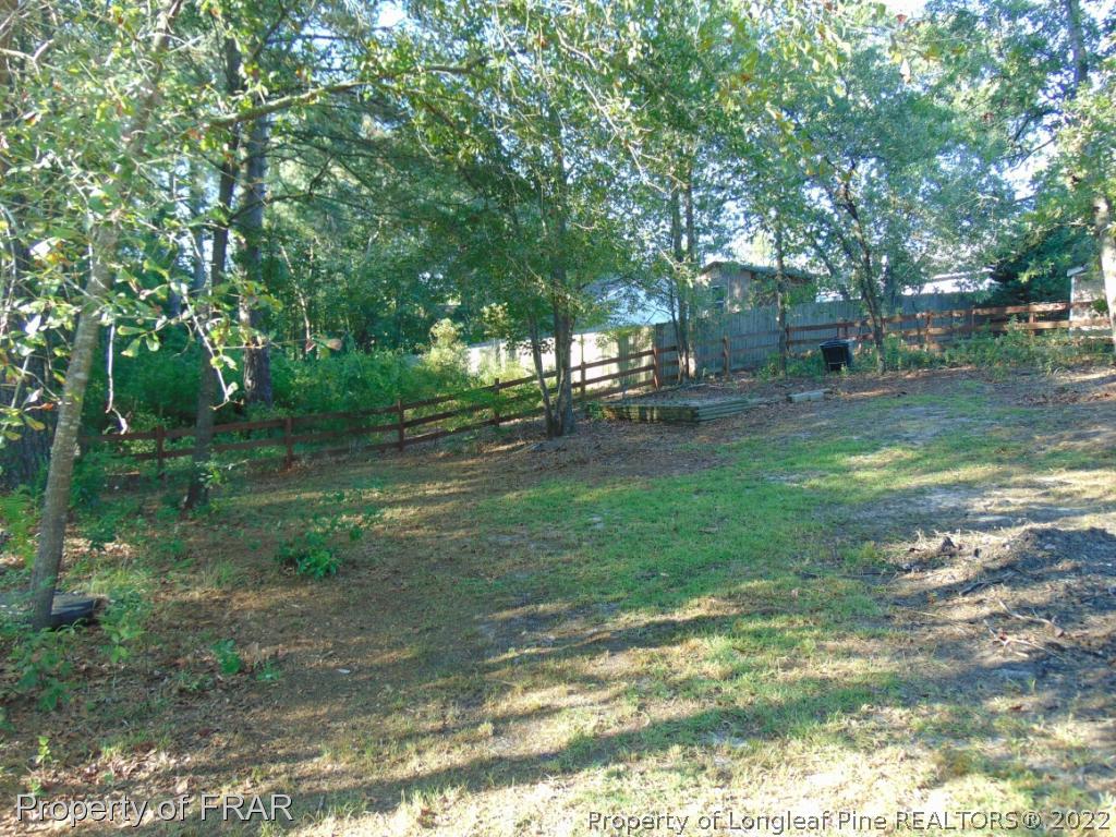 5313 Harding Drive Hope Mills, NC 28348 - Photo 21 of 26 a view of a yard with a tree