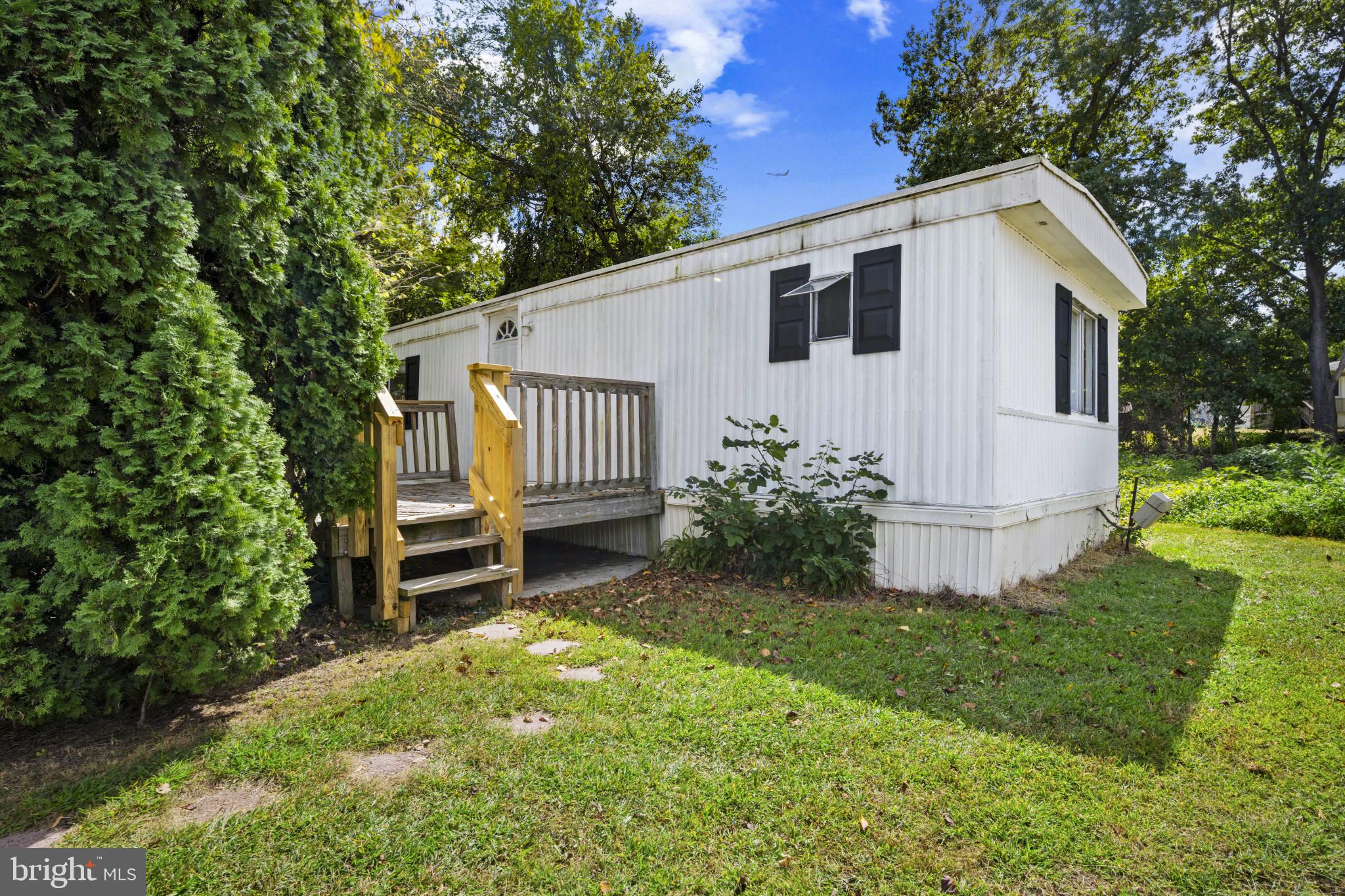 8030 Keeton Road Elkridge, MD 21075 - Photo 1 of 44 a view of a house with backyard and sitting area