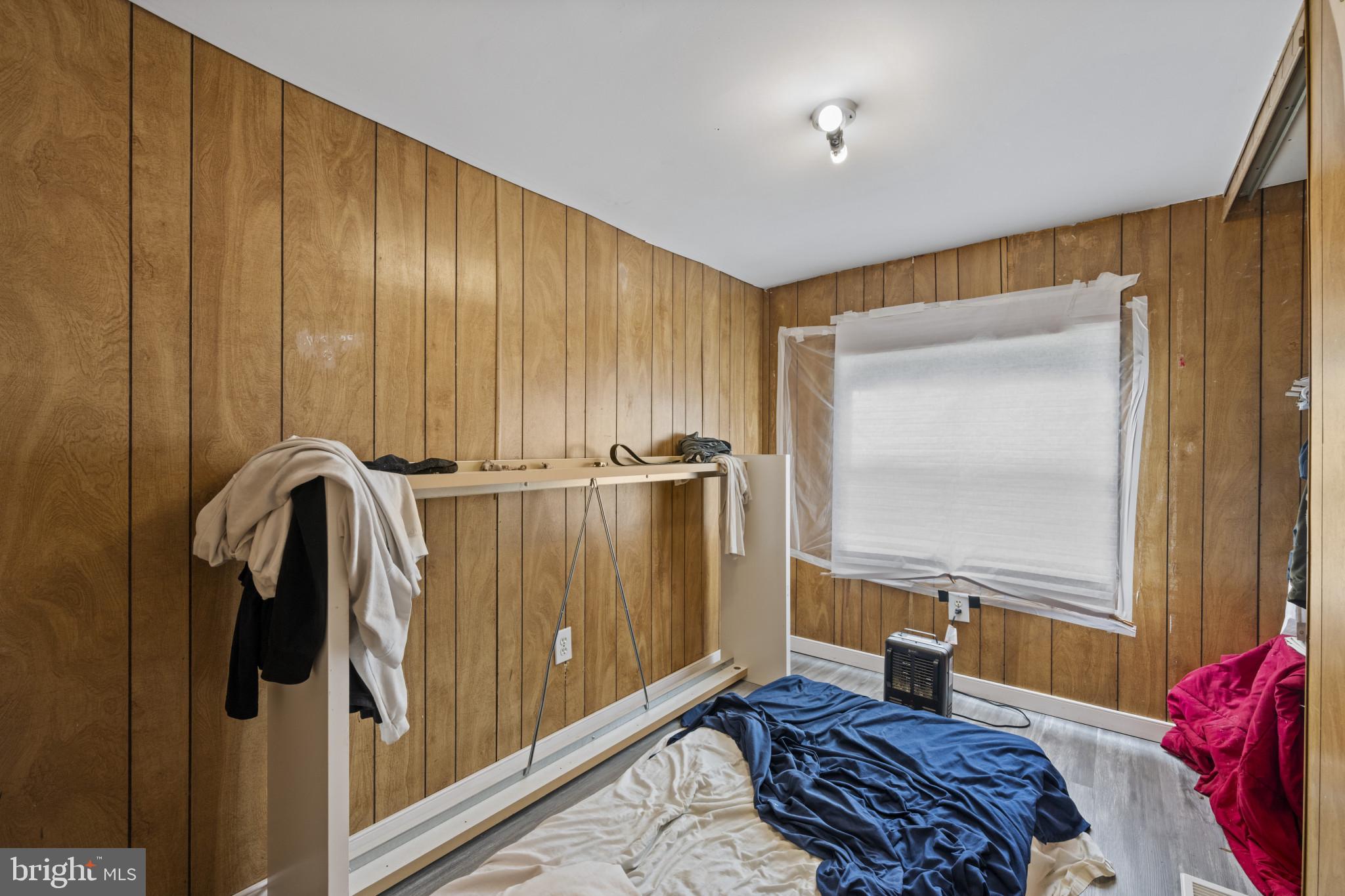 8030 Keeton Road Elkridge, MD 21075 - Photo 19 of 44 a bedroom with a bed and a dresser