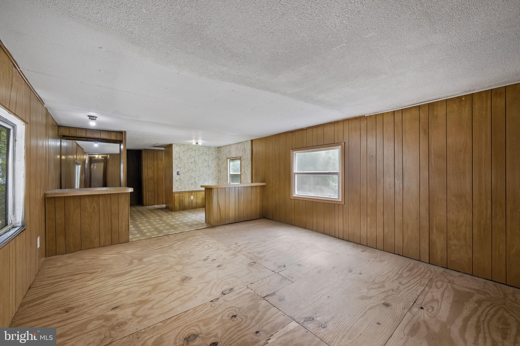 8030 Keeton Road Elkridge, MD 21075 - Photo 2 of 44 a view of a hallway with wooden shelves