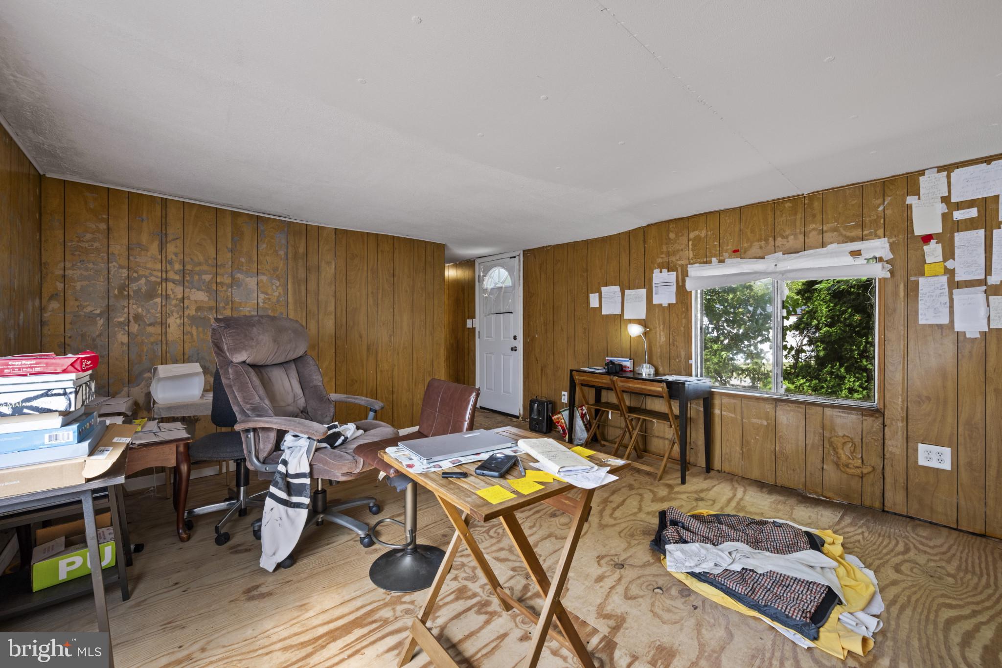 8030 Keeton Road Elkridge, MD 21075 - Photo 24 of 44 a living room with furniture a rug and a floor to ceiling window