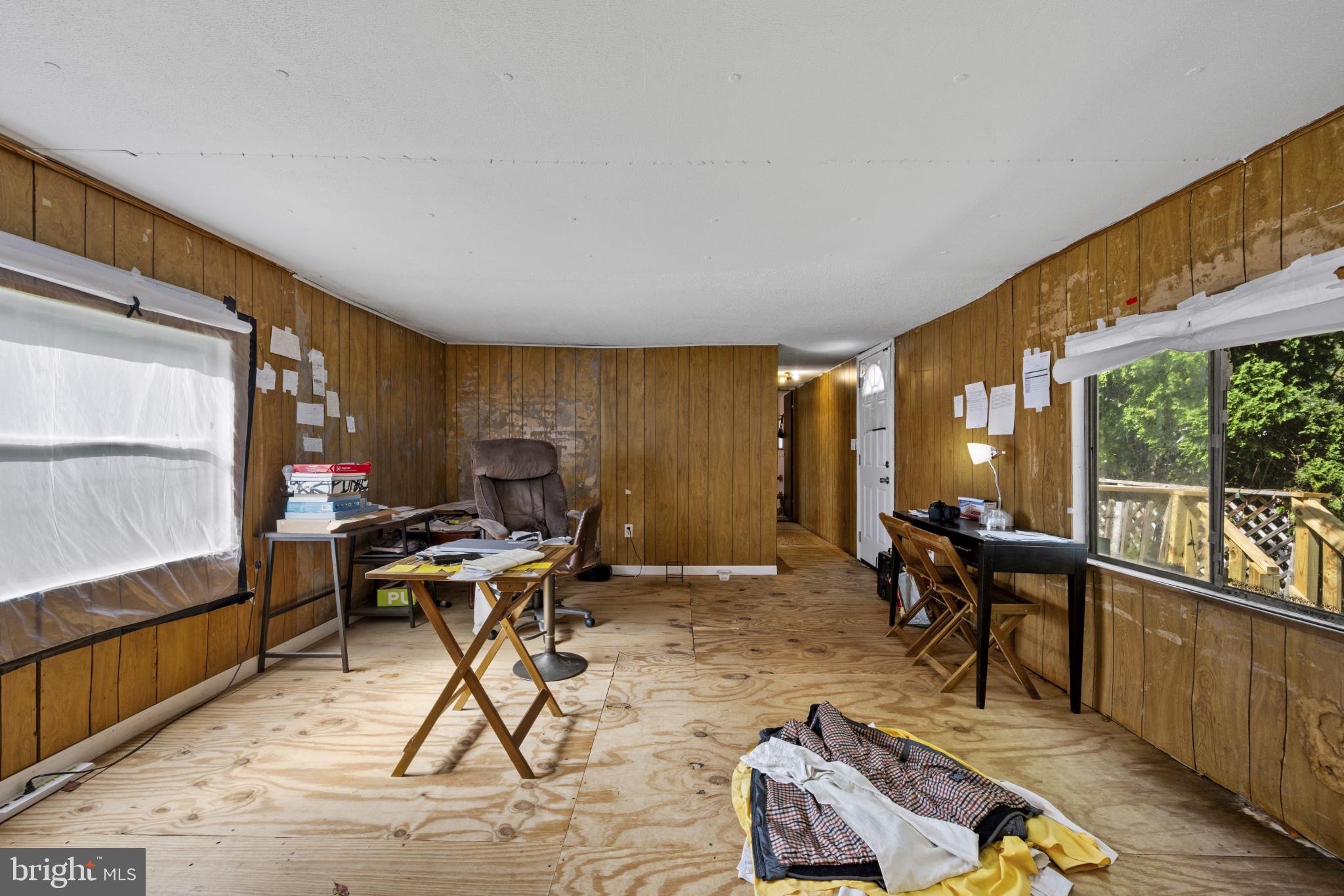 8030 Keeton Road Elkridge, MD 21075 - Photo 28 of 44 a workspace with furniture window and wooden floor