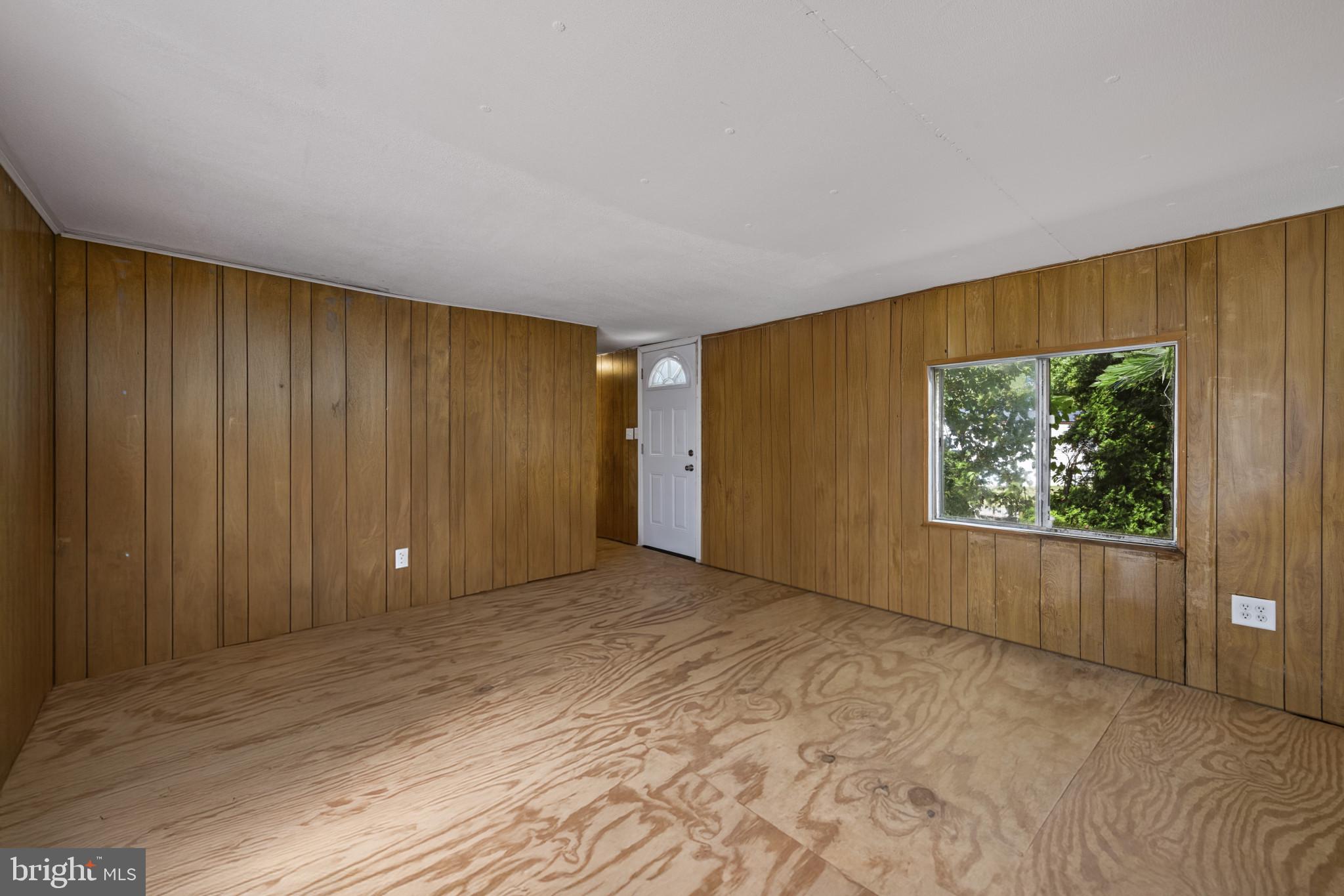 8030 Keeton Road Elkridge, MD 21075 - Photo 3 of 44 a view of an empty room with a window