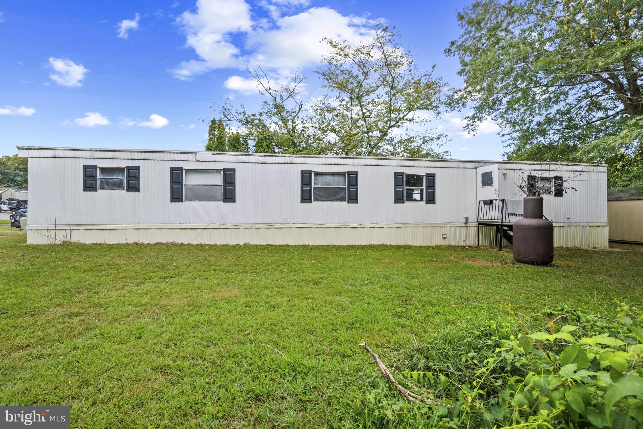8030 Keeton Road Elkridge, MD 21075 - Photo 37 of 44 a front view of house with yard and trees