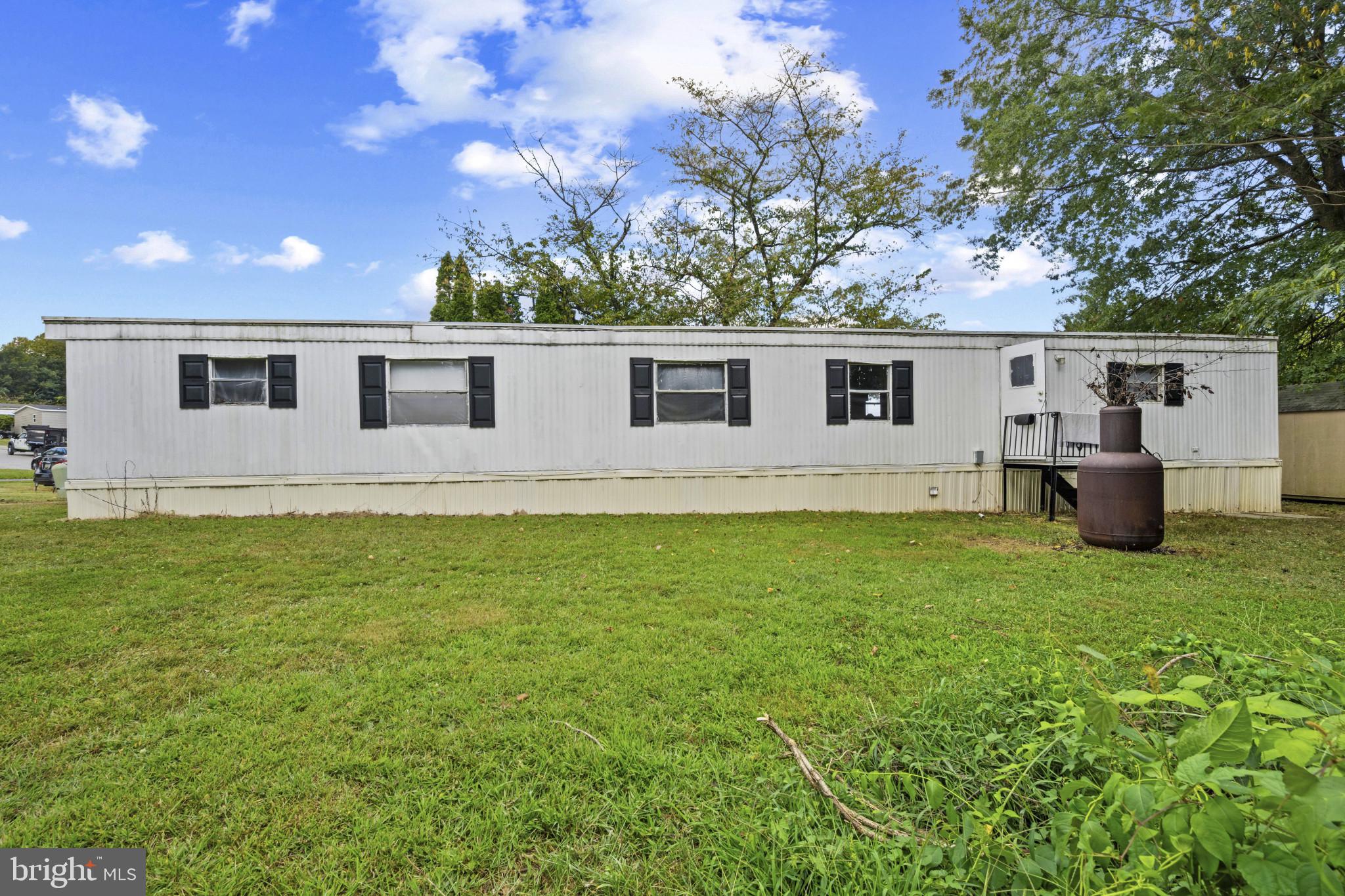 8030 Keeton Road Elkridge, MD 21075 - Photo 38 of 44 a front view of house with yard and trees