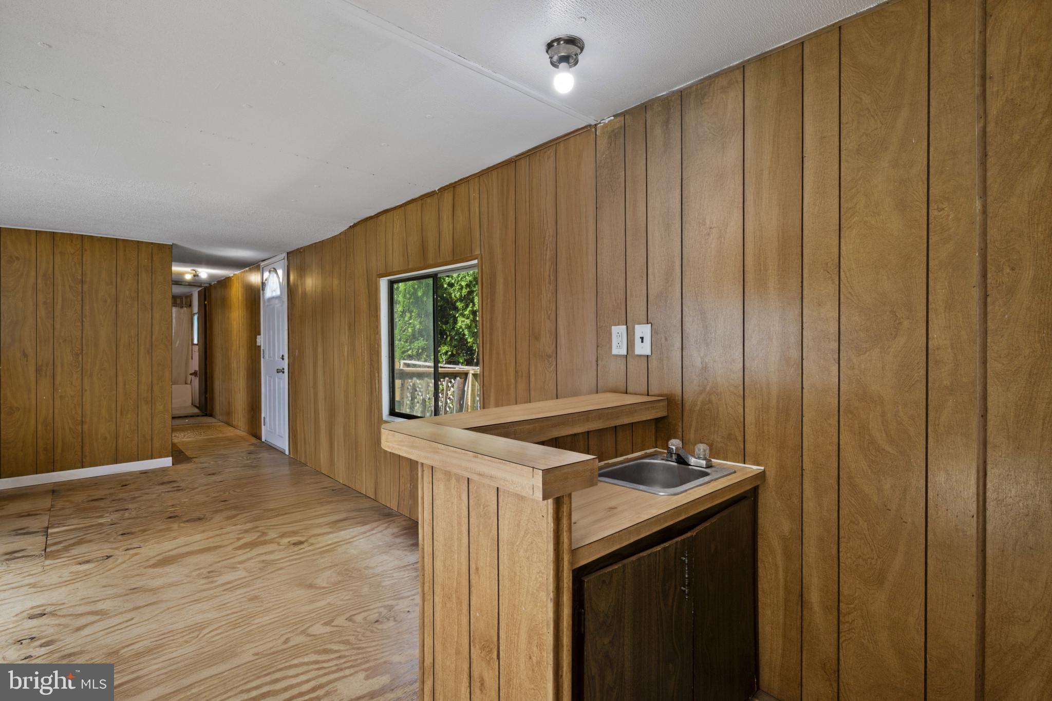 8030 Keeton Road Elkridge, MD 21075 - Photo 5 of 44 a kitchen that has a sink and a stove in it