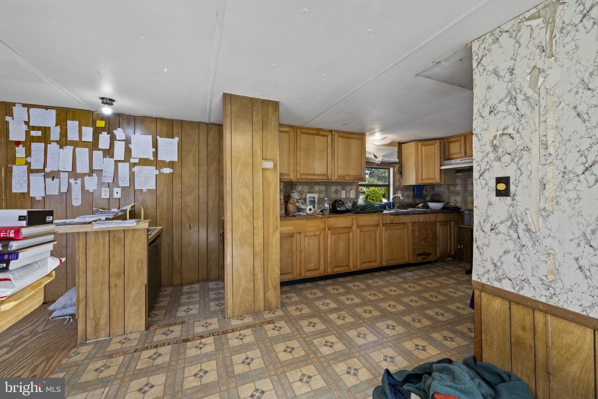 8030 Keeton Road Elkridge, MD 21075 - Photo 9 of 44 a kitchen with stainless steel appliances a refrigerator a sink a stove top oven