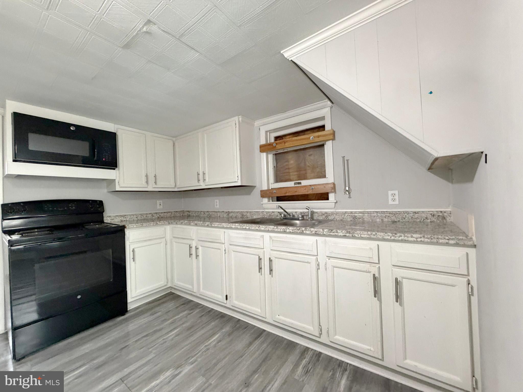 35534 Mt Hermon Road Pittsville, MD 21850 - Photo 14 of 52 a kitchen with granite countertop cabinets stainless steel appliances and sink