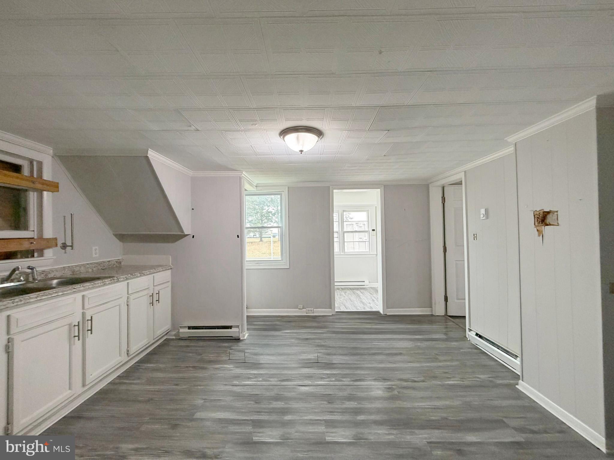 35534 Mt Hermon Road Pittsville, MD 21850 - Photo 18 of 52 a view of a kitchen with a sink and dishwasher wooden floor