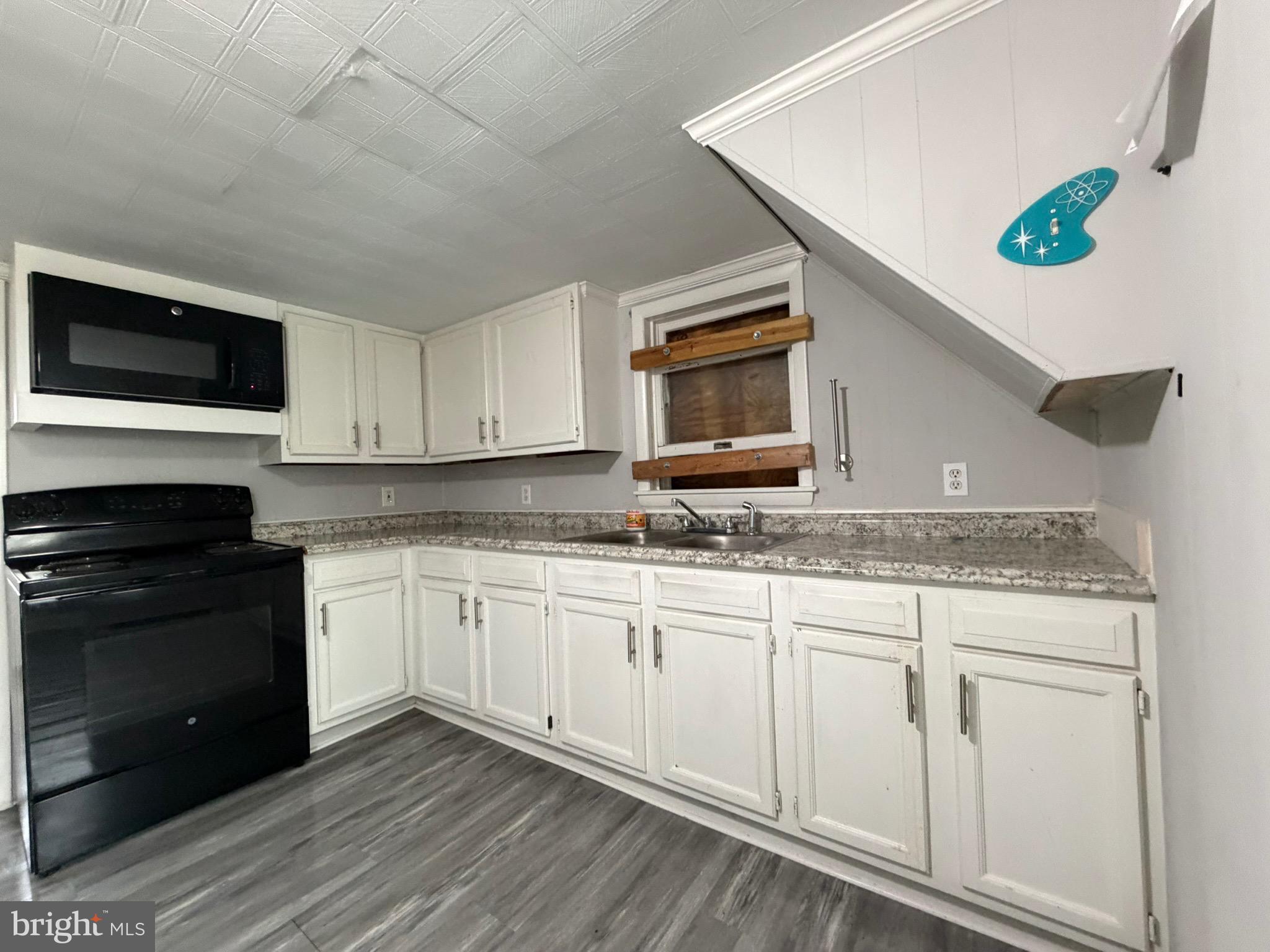 35534 Mt Hermon Road Pittsville, MD 21850 - Photo 19 of 52 a kitchen with granite countertop cabinets stainless steel appliances and a sink