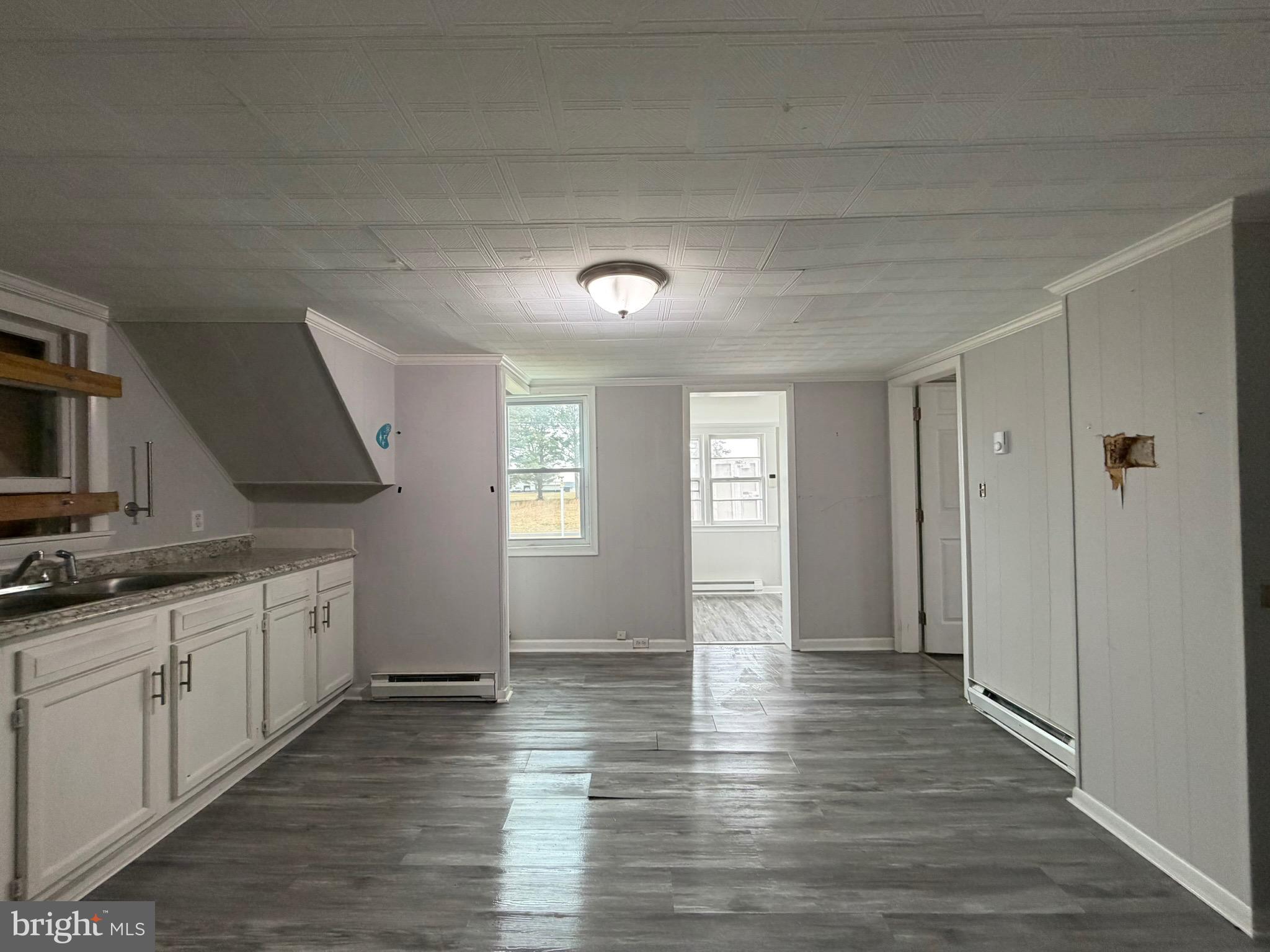 35534 Mt Hermon Road Pittsville, MD 21850 - Photo 21 of 52 a view of a kitchen with a sink dishwasher and wooden floor