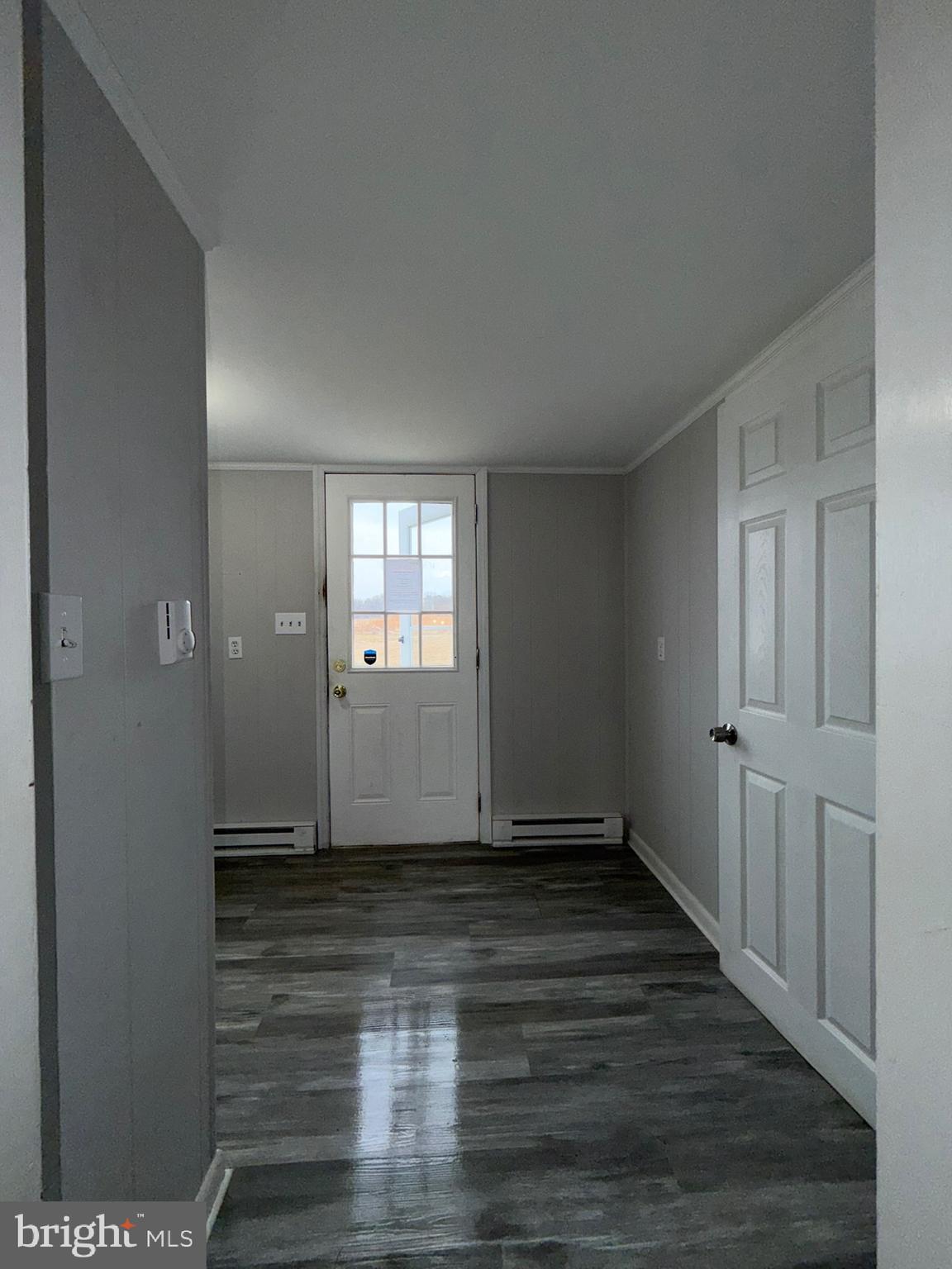 35534 Mt Hermon Road Pittsville, MD 21850 - Photo 23 of 52 a view of an empty room with wooden floor and a window