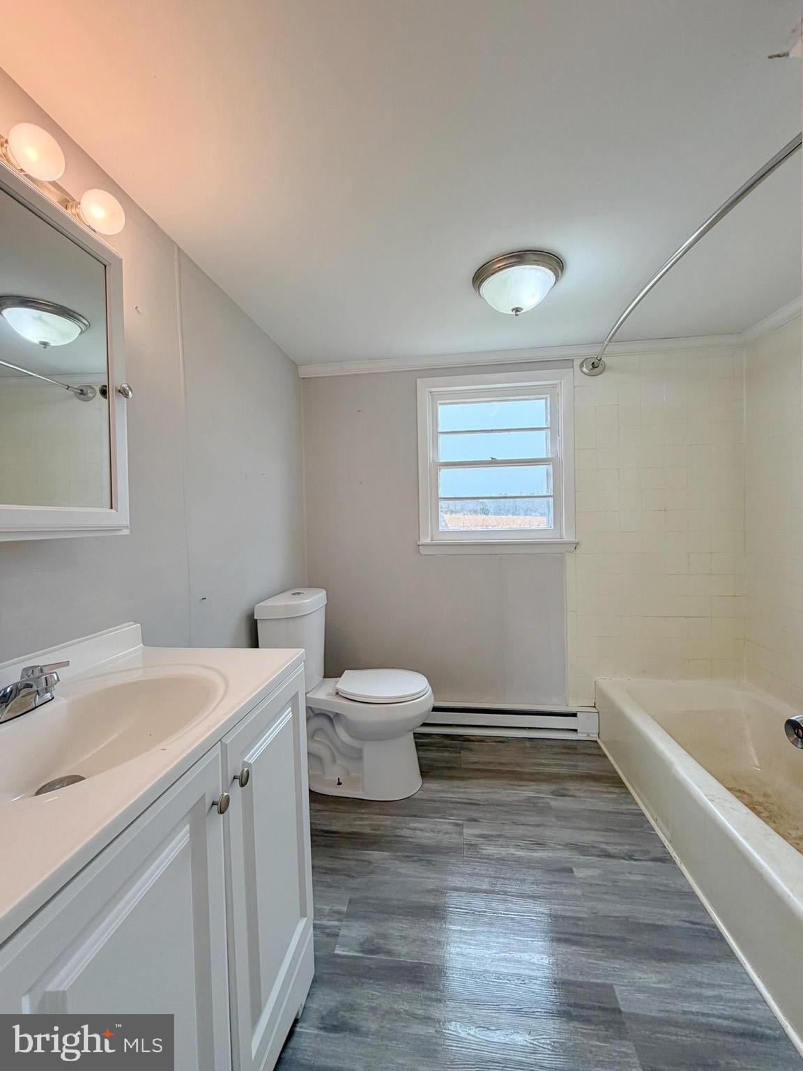 35534 Mt Hermon Road Pittsville, MD 21850 - Photo 28 of 52 a bathroom with a sink a toilet and bathtub