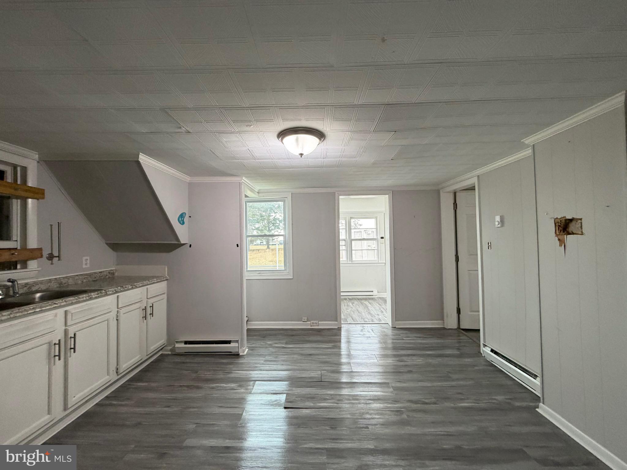 35534 Mt Hermon Road Pittsville, MD 21850 - Photo 29 of 52 an empty room with wooden floor and a window