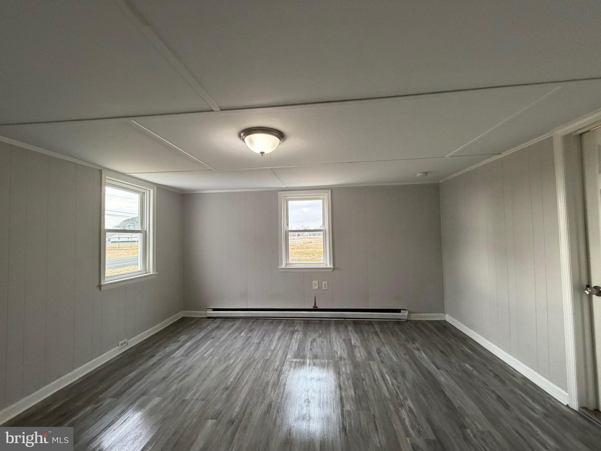 35534 Mt Hermon Road Pittsville, MD 21850 - Photo 35 of 52 an empty room with wooden floor and windows
