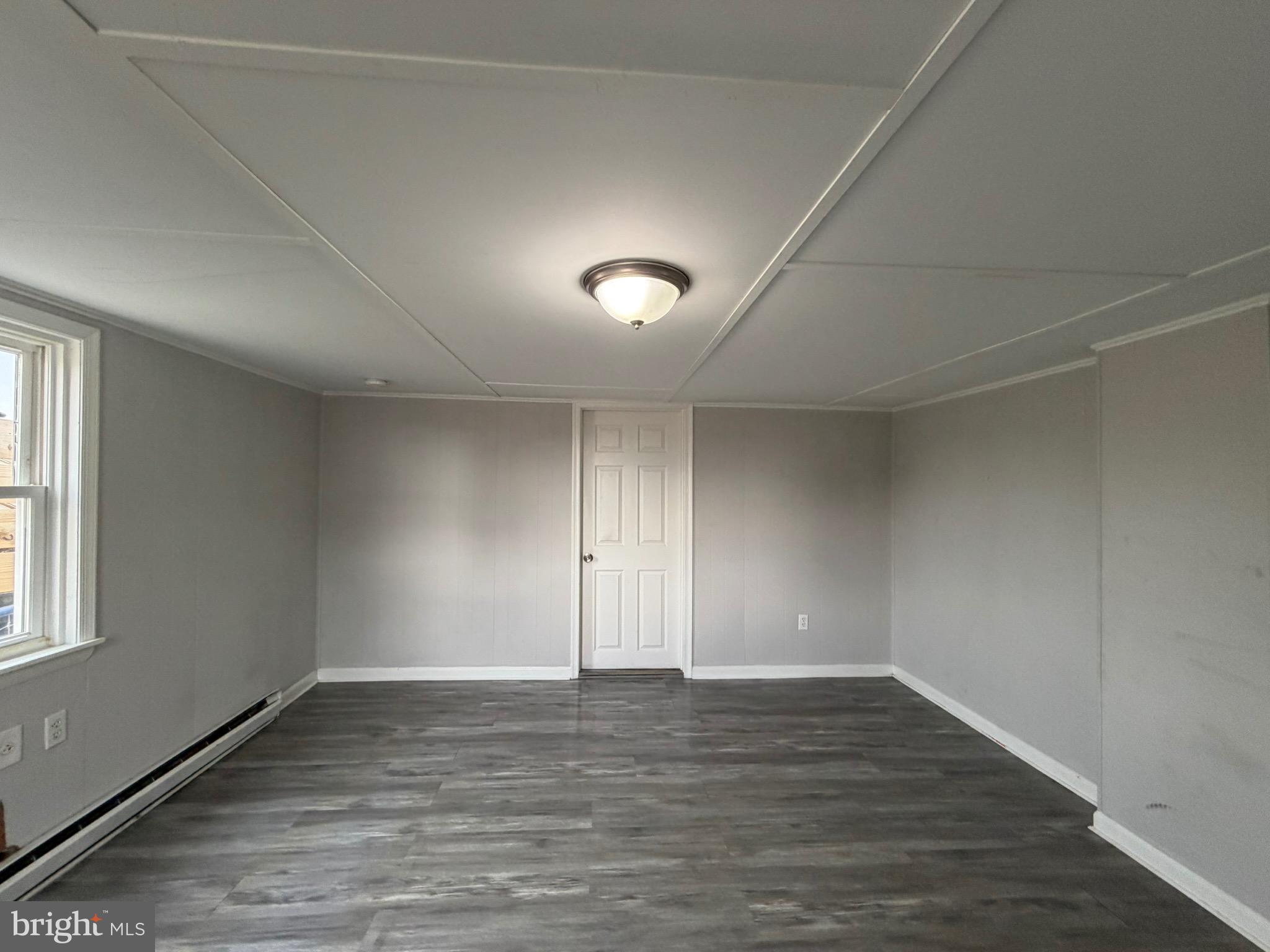 35534 Mt Hermon Road Pittsville, MD 21850 - Photo 37 of 52 wooden floor in an empty room with a window