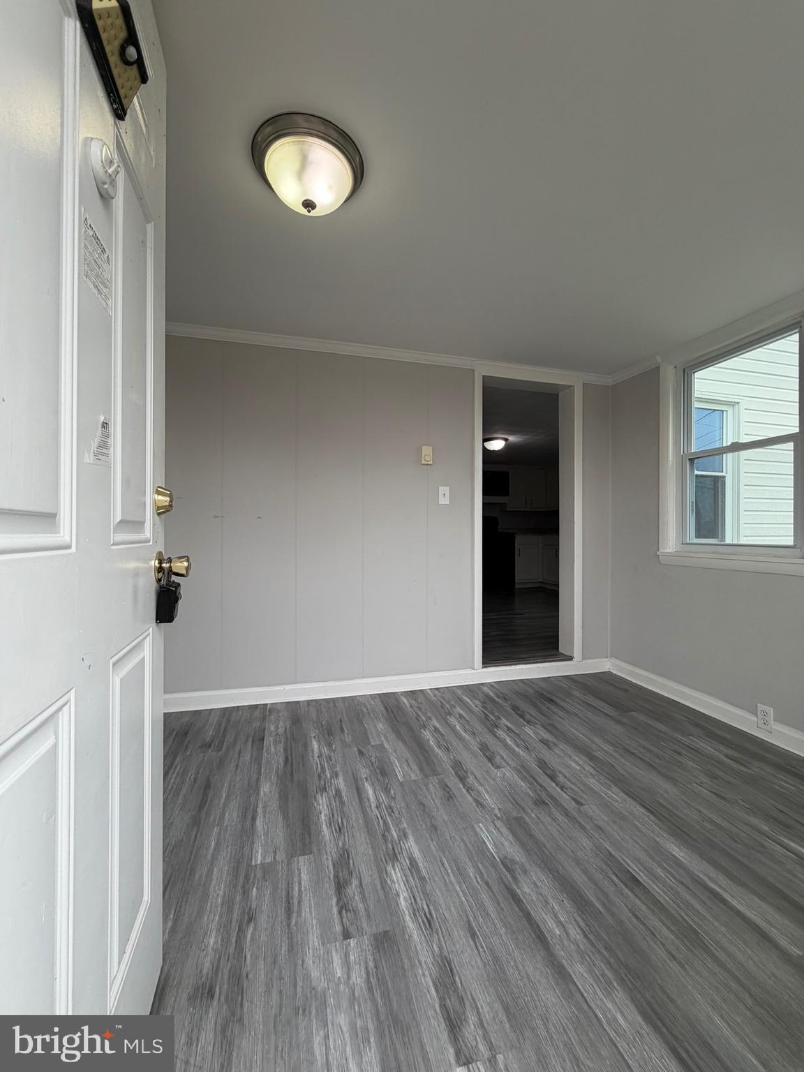 35534 Mt Hermon Road Pittsville, MD 21850 - Photo 5 of 52 wooden floor in an empty room with a window