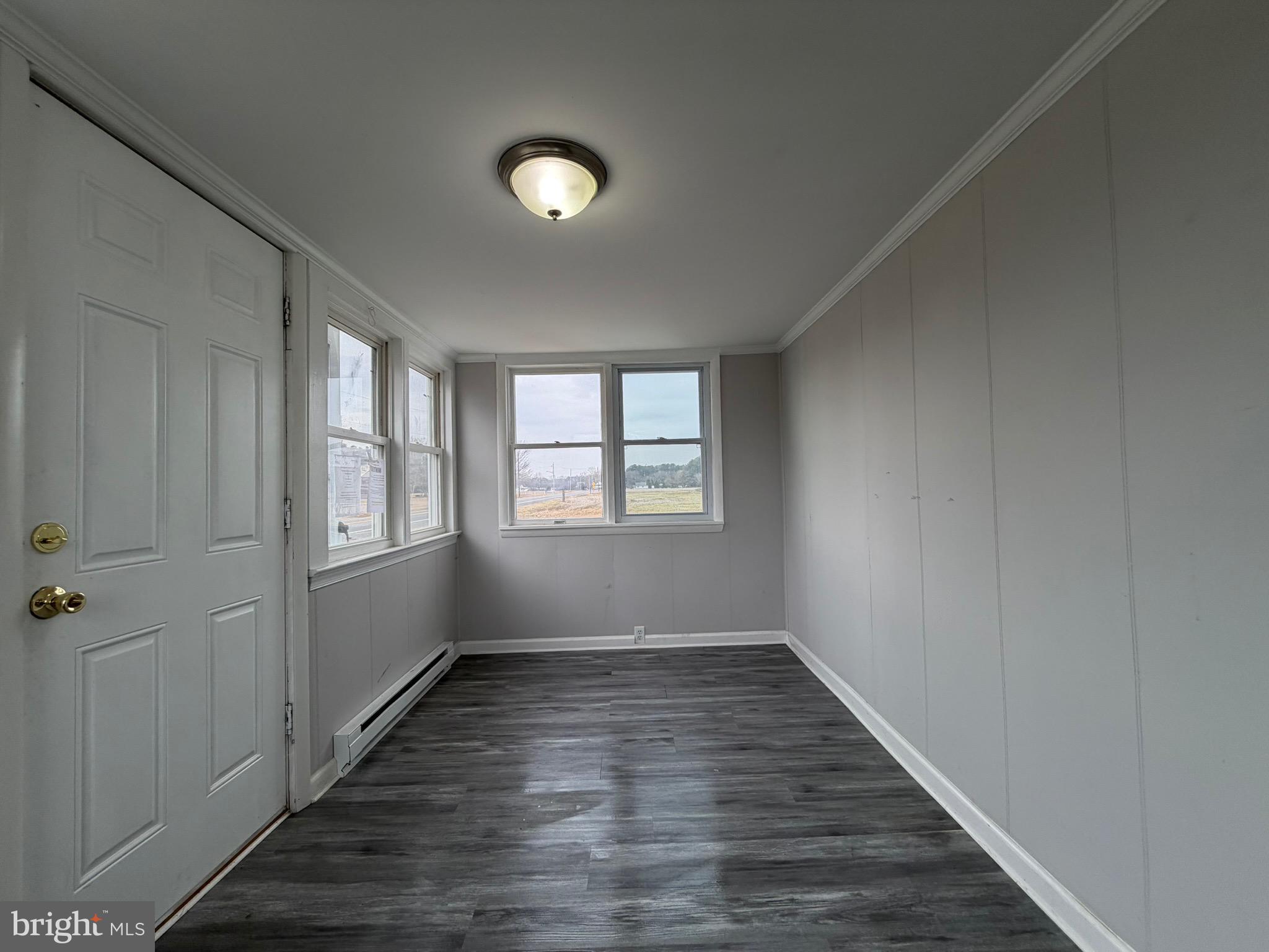 35534 Mt Hermon Road Pittsville, MD 21850 - Photo 9 of 52 wooden floor in an empty room with a window