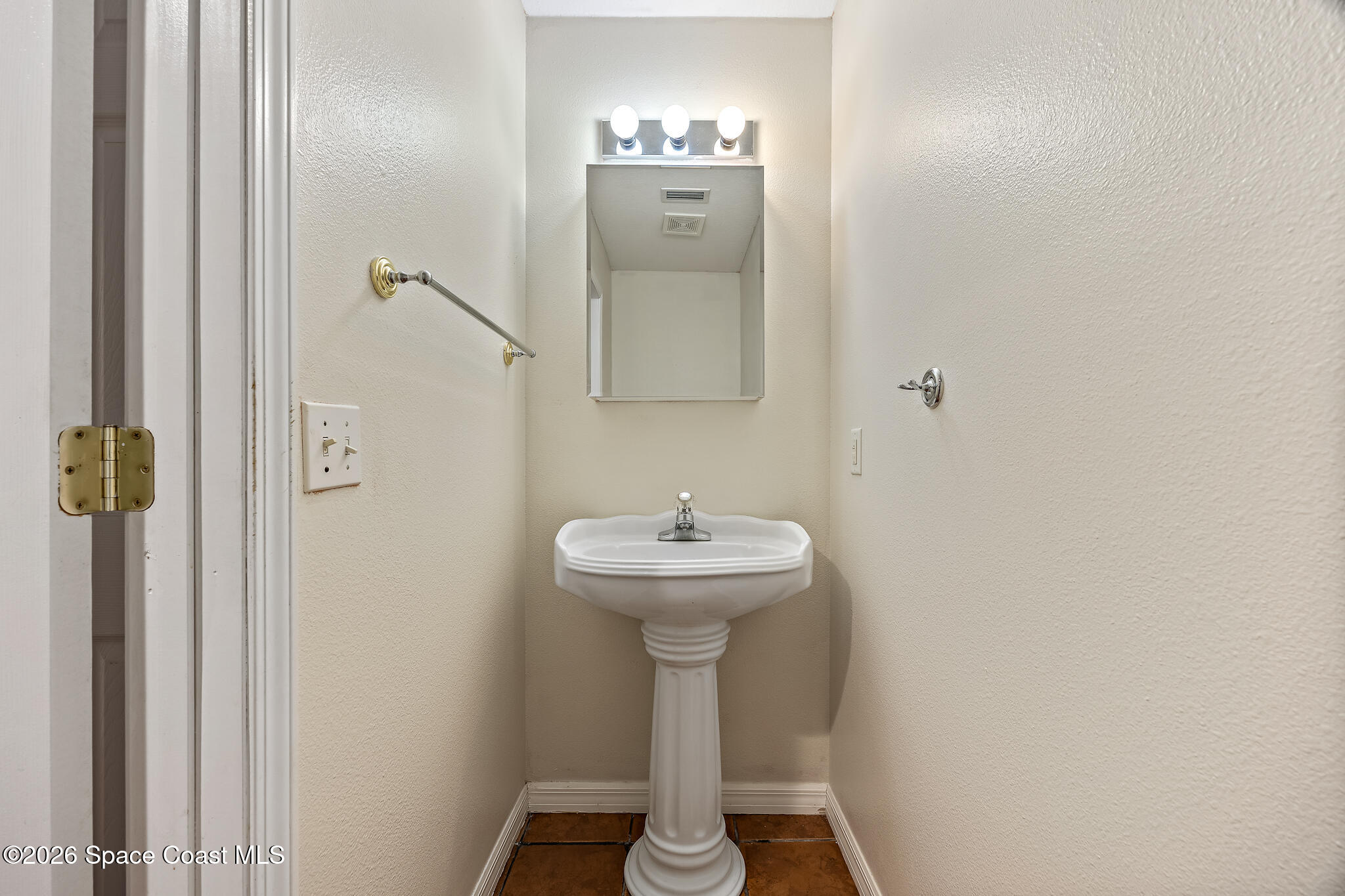 503 Arbor Ridge Lane Titusville, FL 32780 - Photo 13 of 38 a bathroom with a sink a mirror and shower