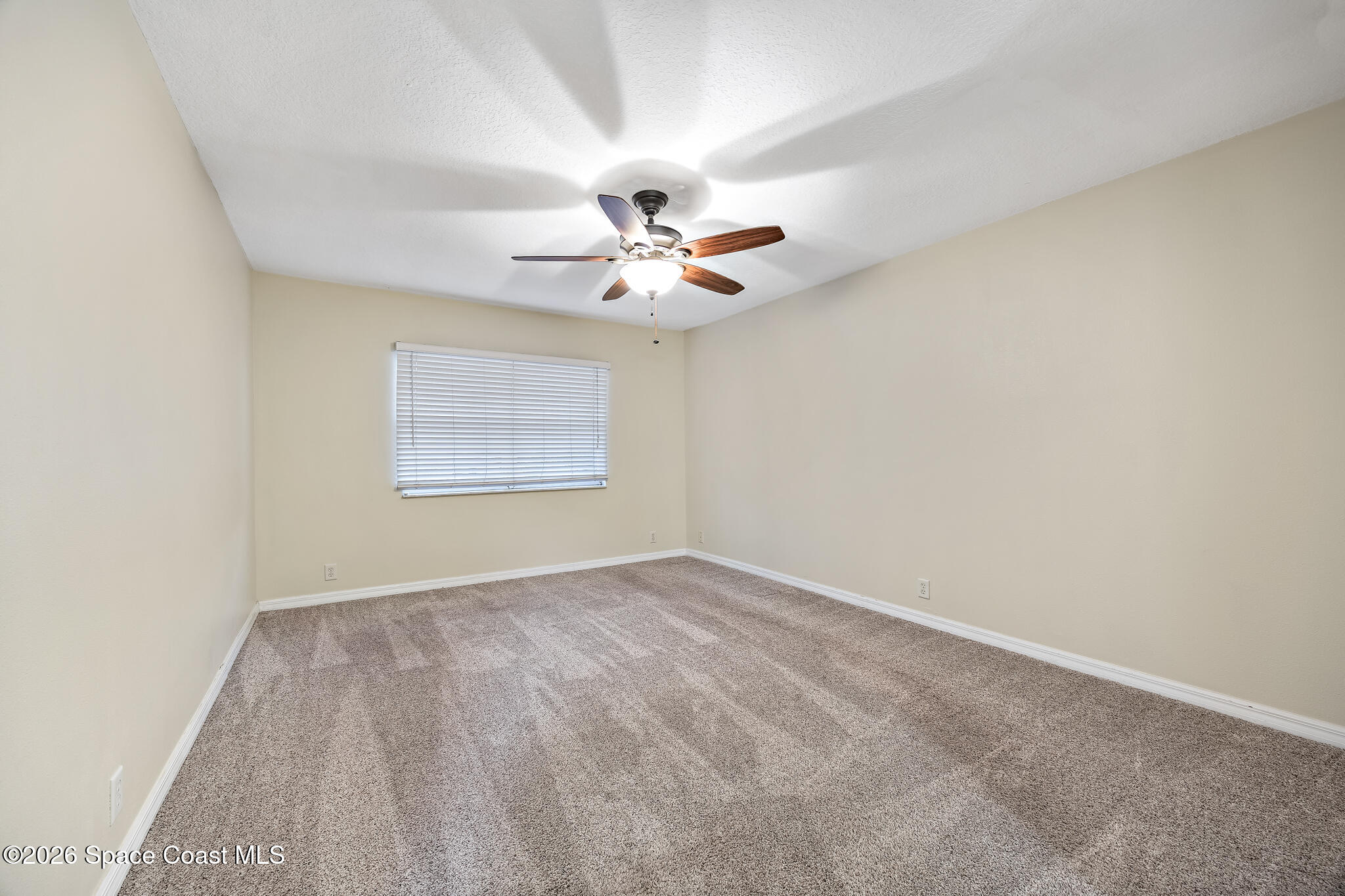 503 Arbor Ridge Lane Titusville, FL 32780 - Photo 16 of 38 an empty room with windows and ceiling fan