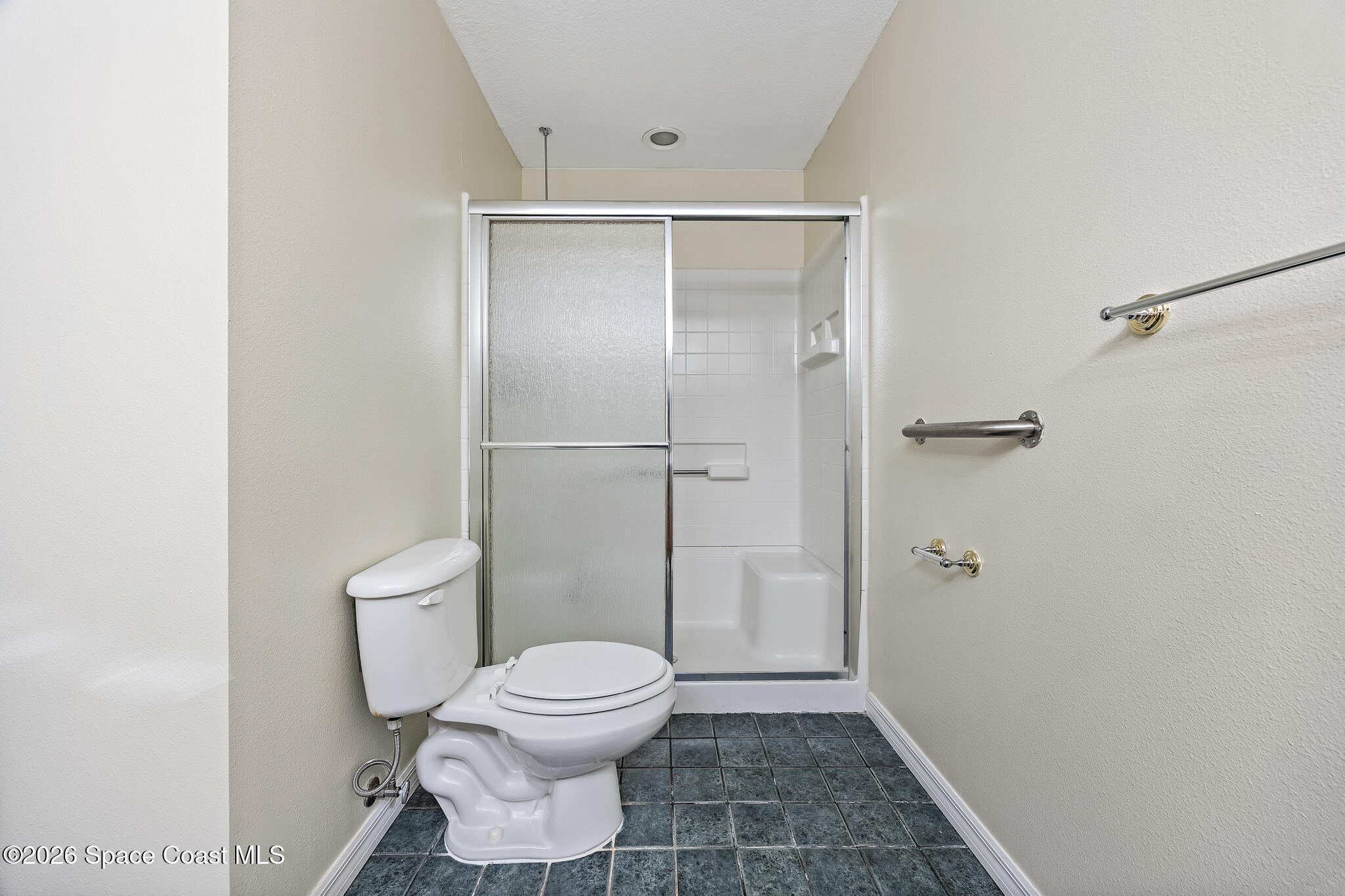 503 Arbor Ridge Lane Titusville, FL 32780 - Photo 19 of 38 a bathroom with a toilet and a shower