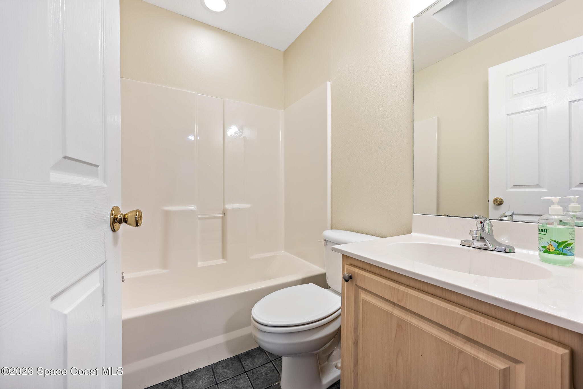 503 Arbor Ridge Lane Titusville, FL 32780 - Photo 23 of 38 a bathroom with a sink a toilet and a bathtub