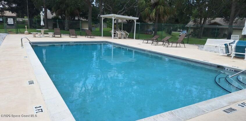 503 Arbor Ridge Lane Titusville, FL 32780 - Photo 32 of 38 a view of a swimming pool with a patio