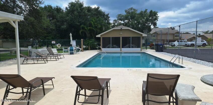503 Arbor Ridge Lane Titusville, FL 32780 - Photo 33 of 38 a view of an house with backyard and furniture