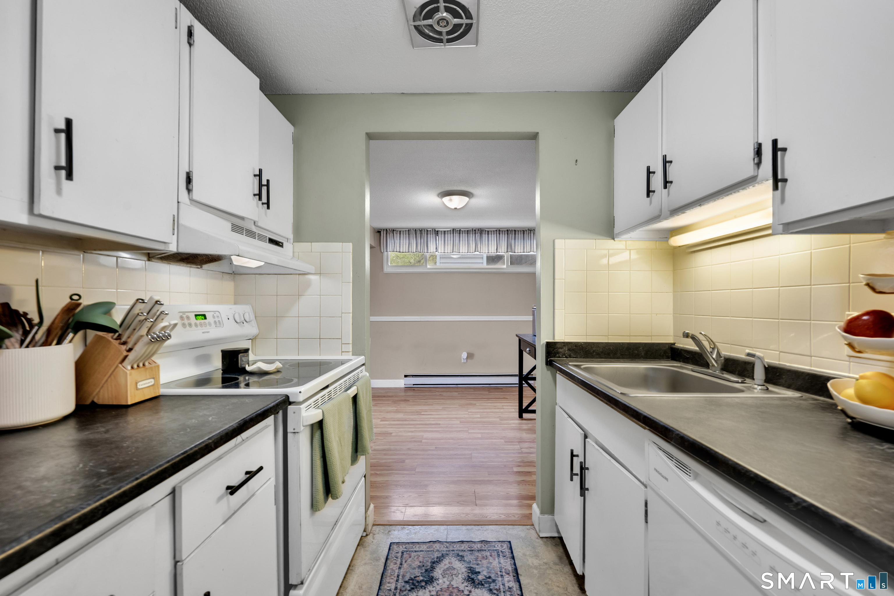 56 Cinnamon Spring, Unit 56 South Windsor, CT 06074 - Photo 11 of 31 a kitchen with sink and cabinets