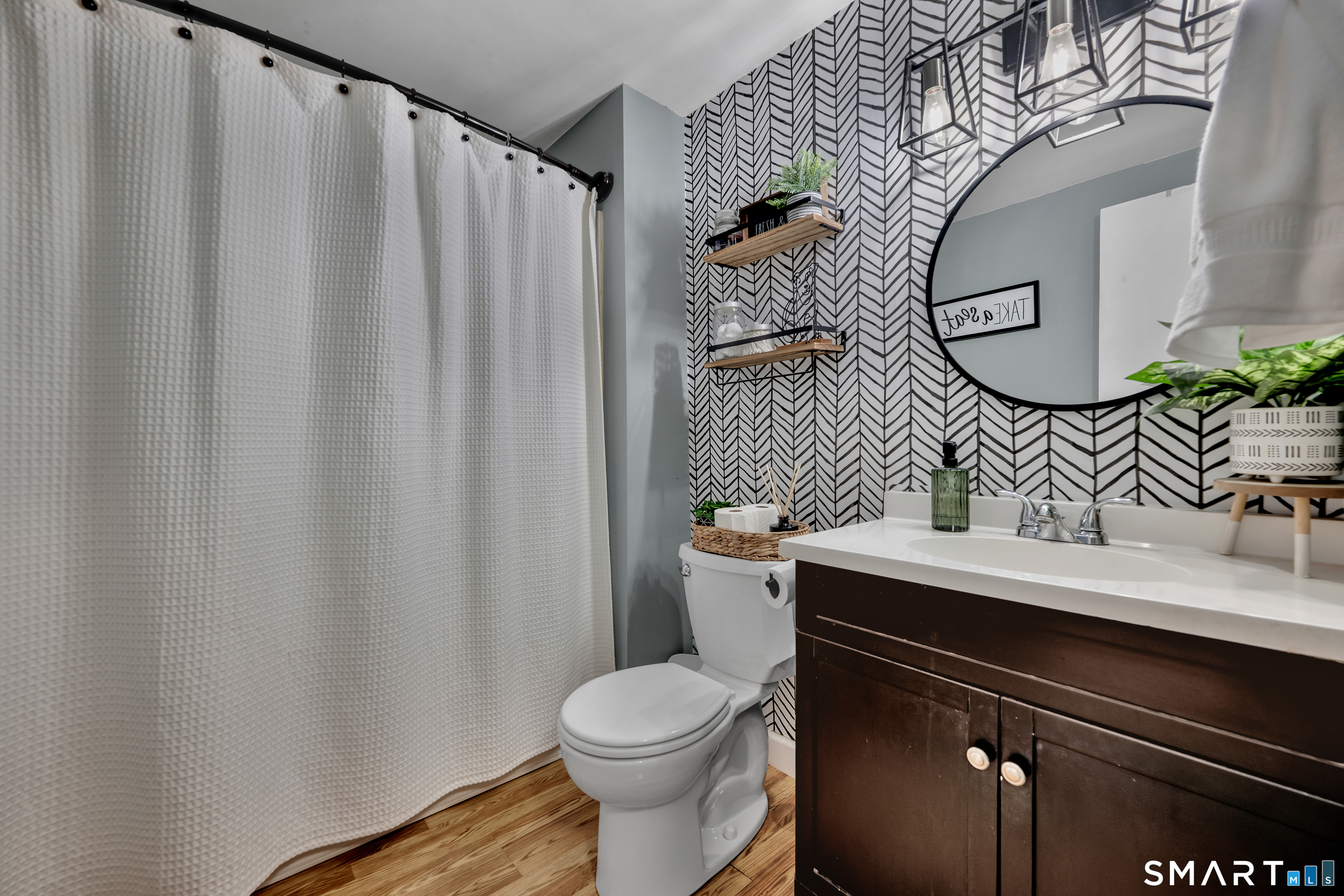 56 Cinnamon Spring, Unit 56 South Windsor, CT 06074 - Photo 13 of 31 a bathroom with a sink toilet and mirror