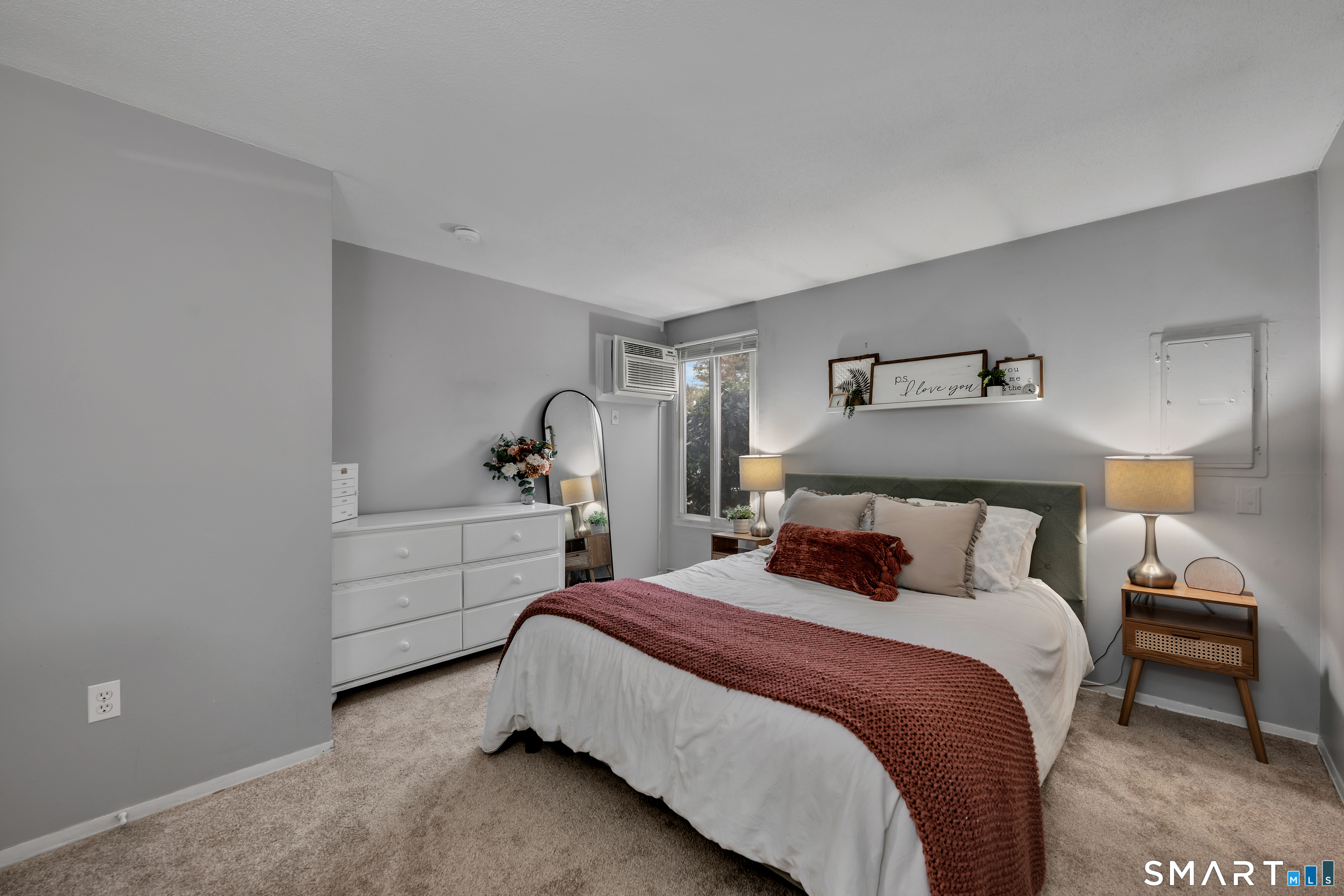 56 Cinnamon Spring, Unit 56 South Windsor, CT 06074 - Photo 14 of 31 a bedroom with a bed and a lamp