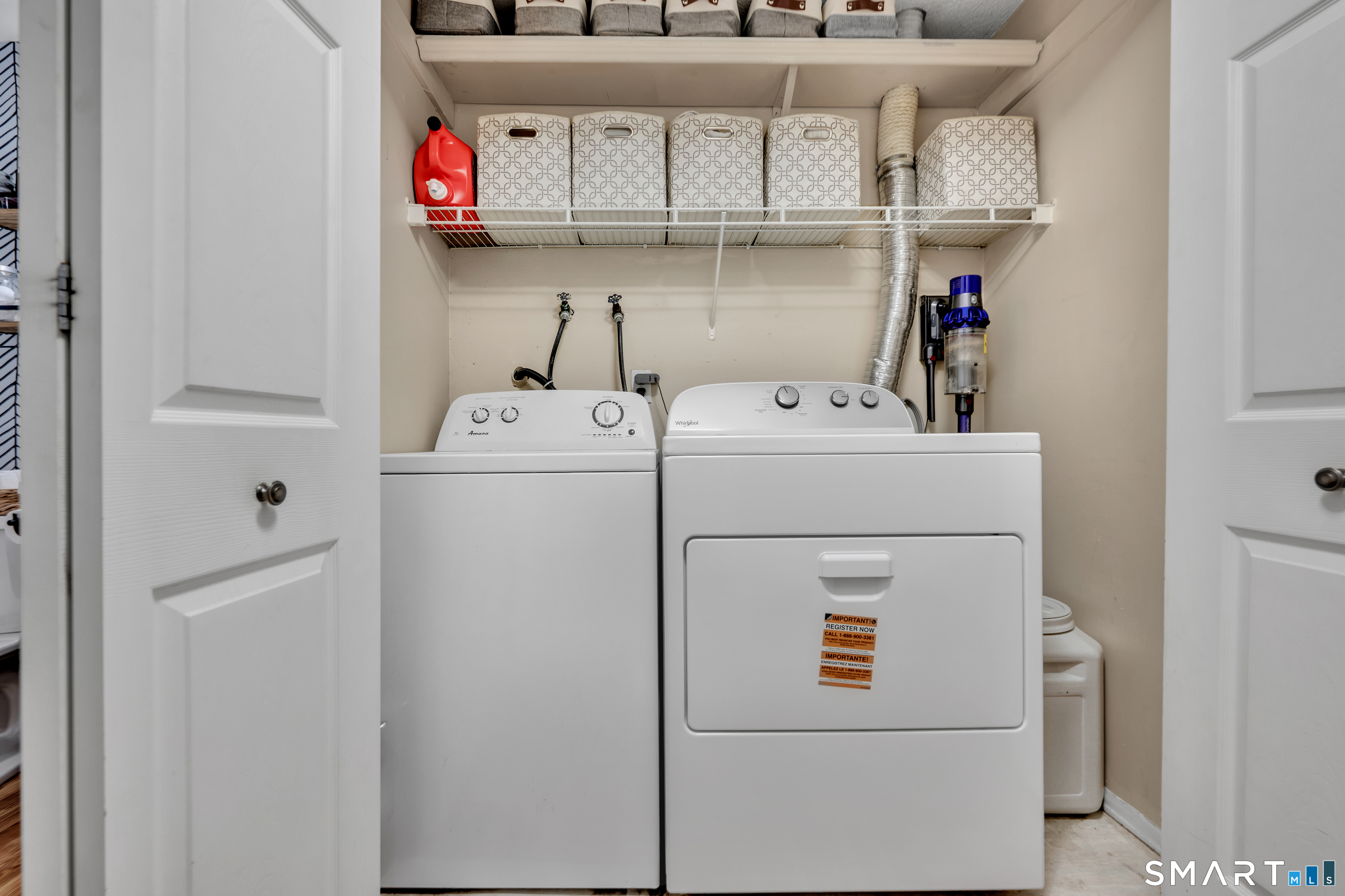 56 Cinnamon Spring, Unit 56 South Windsor, CT 06074 - Photo 17 of 31 a utility room with dryer and washer