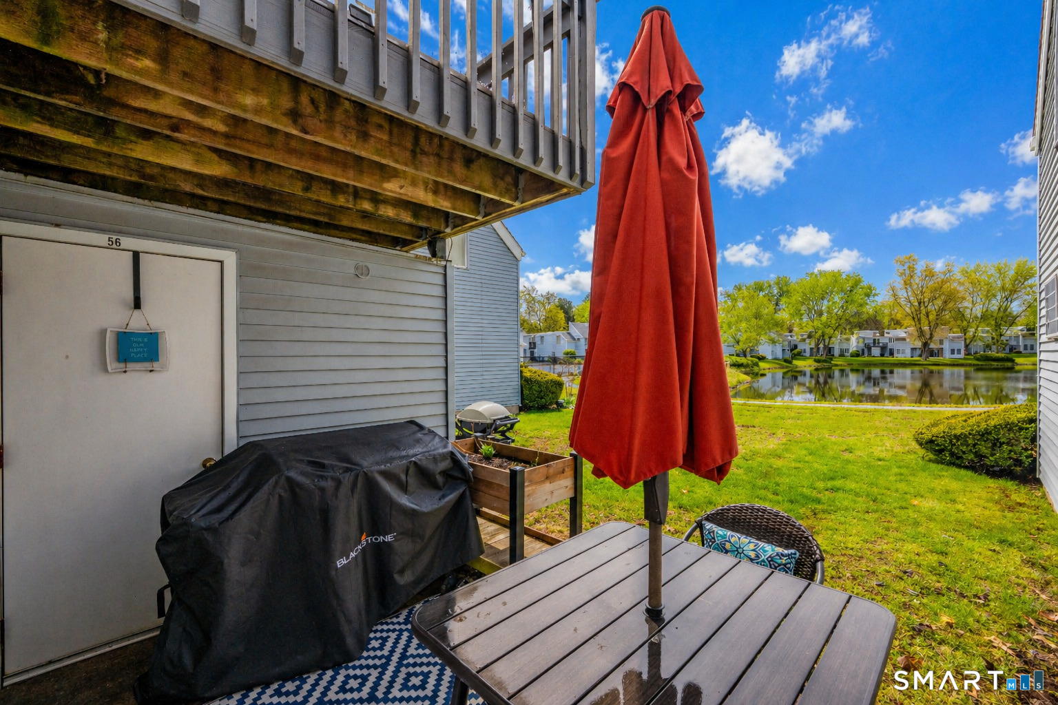 56 Cinnamon Spring, Unit 56 South Windsor, CT 06074 - Photo 21 of 31 a view of a backyard with sitting area