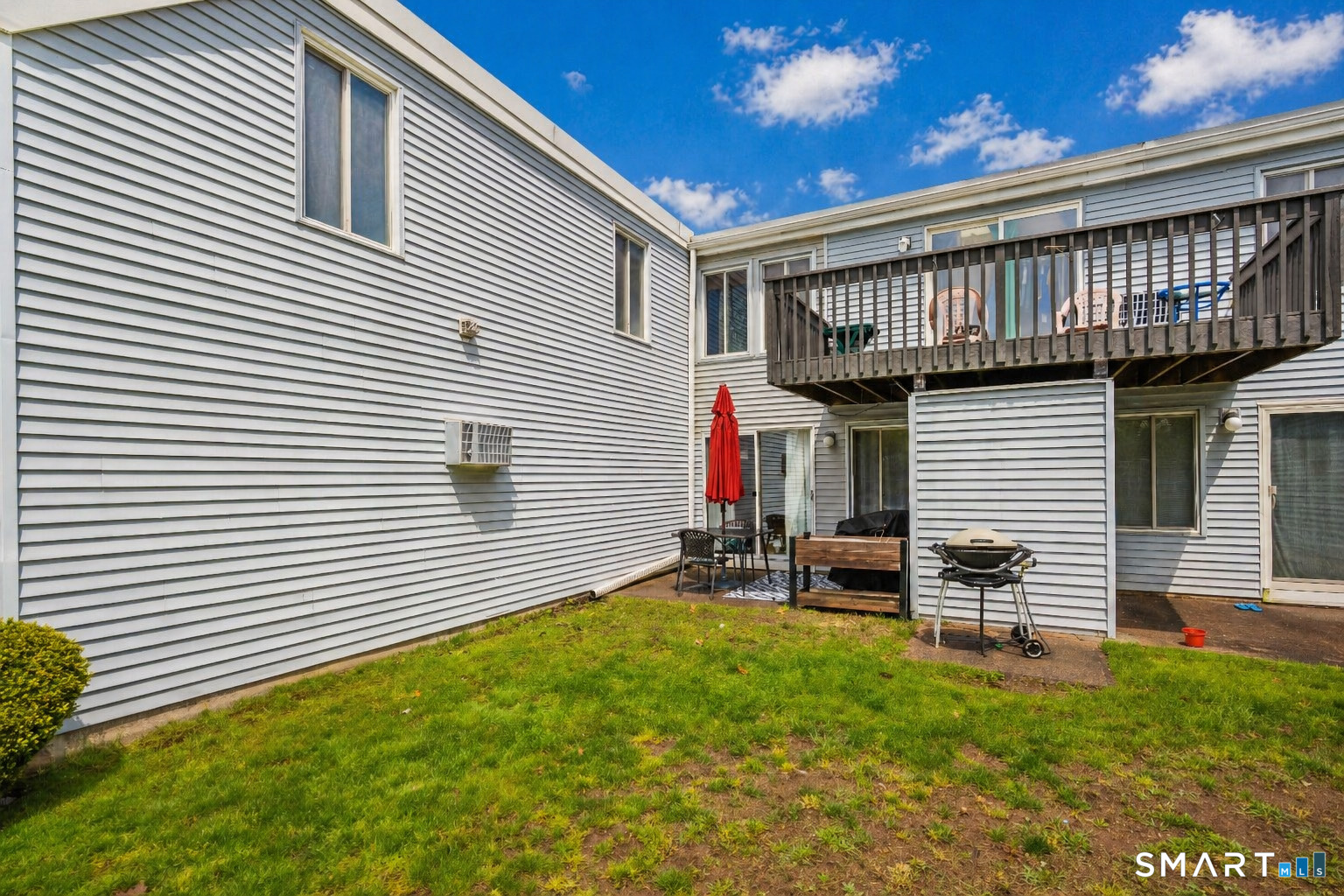 56 Cinnamon Spring, Unit 56 South Windsor, CT 06074 - Photo 23 of 31 a view of a house with a backyard