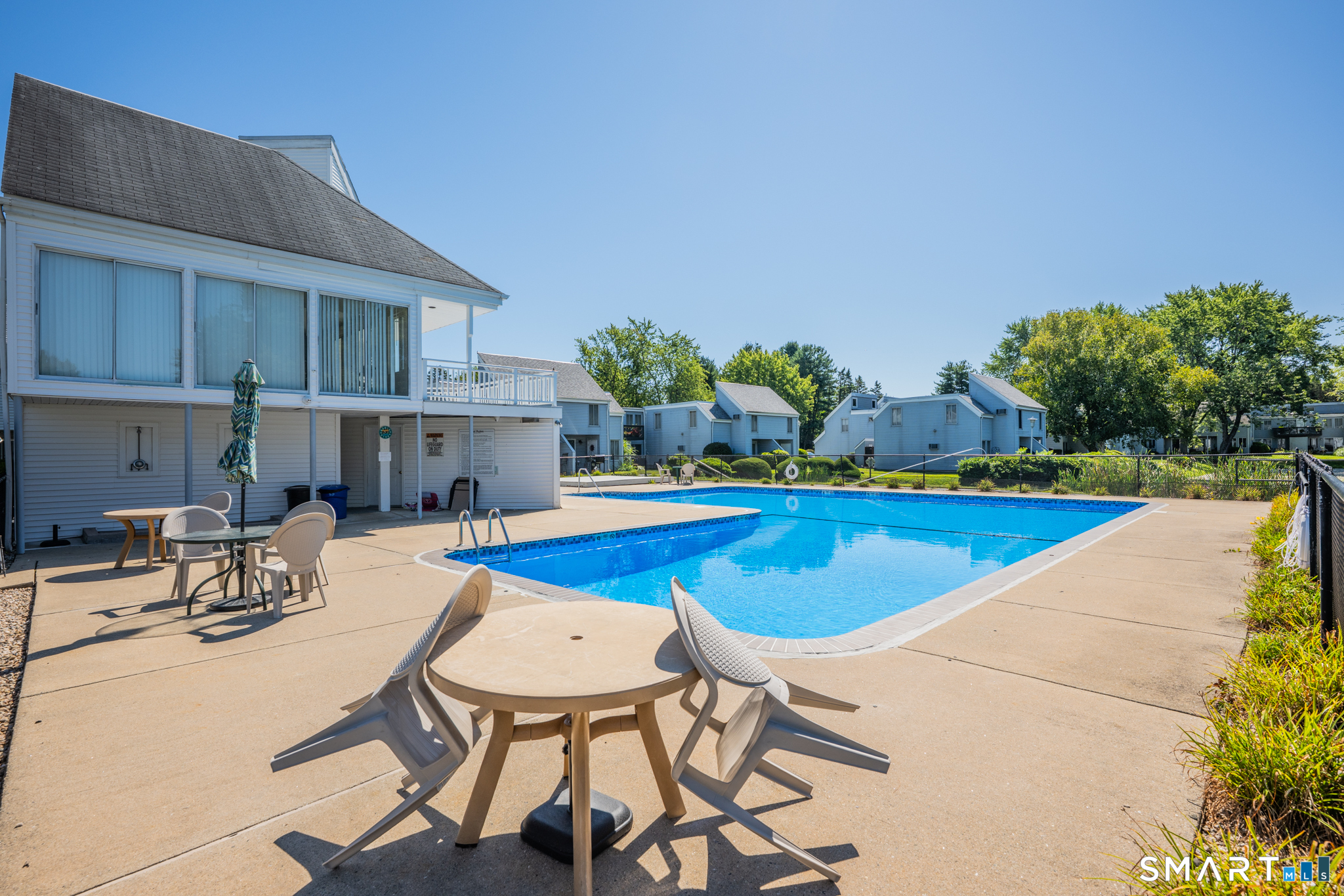56 Cinnamon Spring, Unit 56 South Windsor, CT 06074 - Photo 26 of 31 a view of a house with swimming pool and sitting area