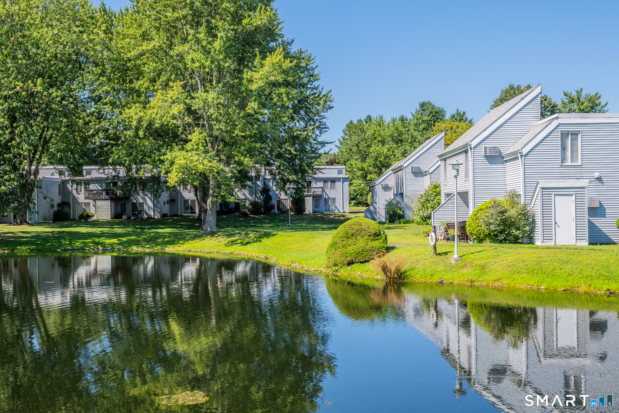 56 Cinnamon Spring, Unit 56 South Windsor, CT 06074 - Photo 27 of 31 a view of a house with swimming pool and sitting area