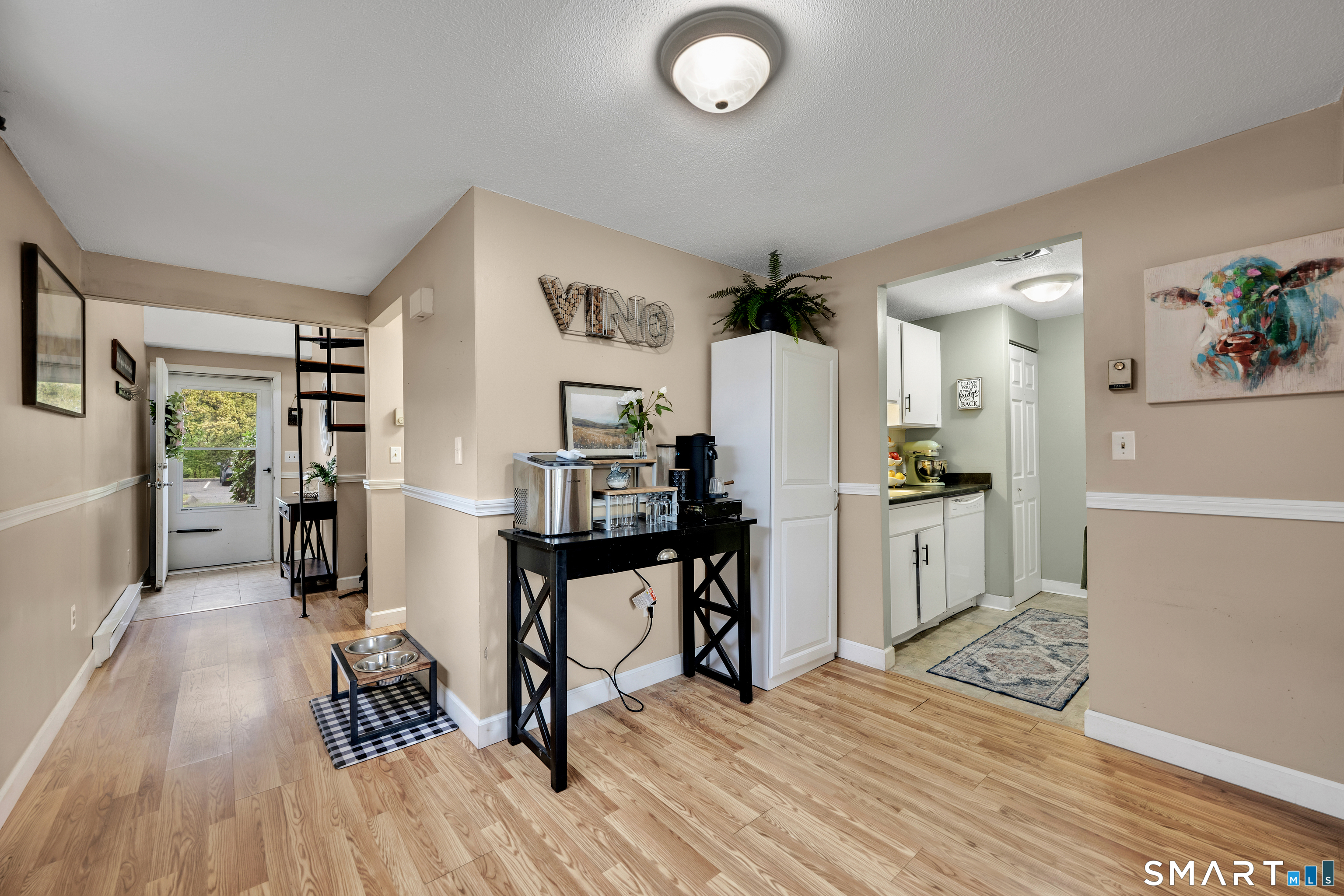 56 Cinnamon Spring, Unit 56 South Windsor, CT 06074 - Photo 5 of 31 a view of kitchen with furniture and wooden floor