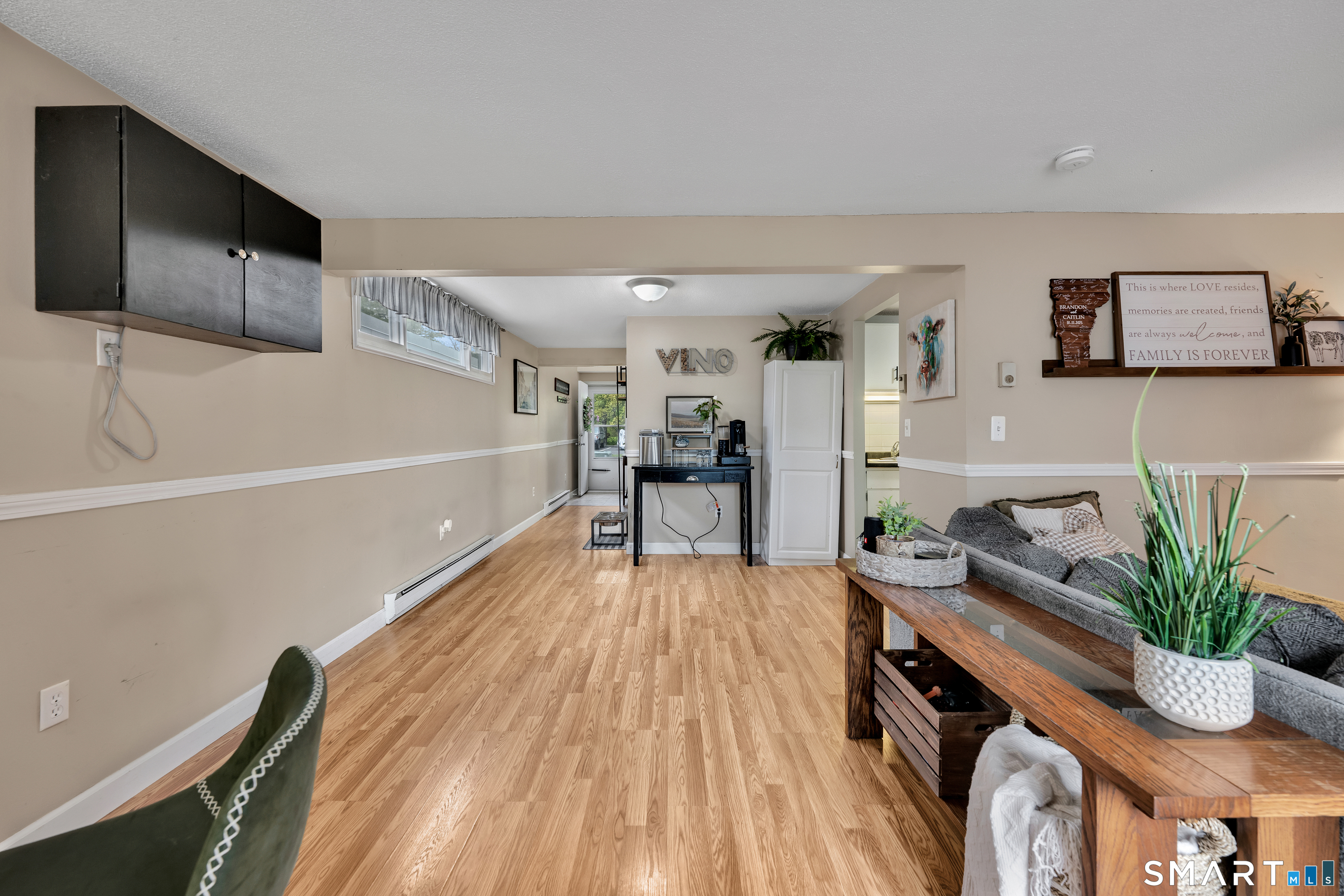 56 Cinnamon Spring, Unit 56 South Windsor, CT 06074 - Photo 6 of 31 a view of livingroom with furniture and wooden floor