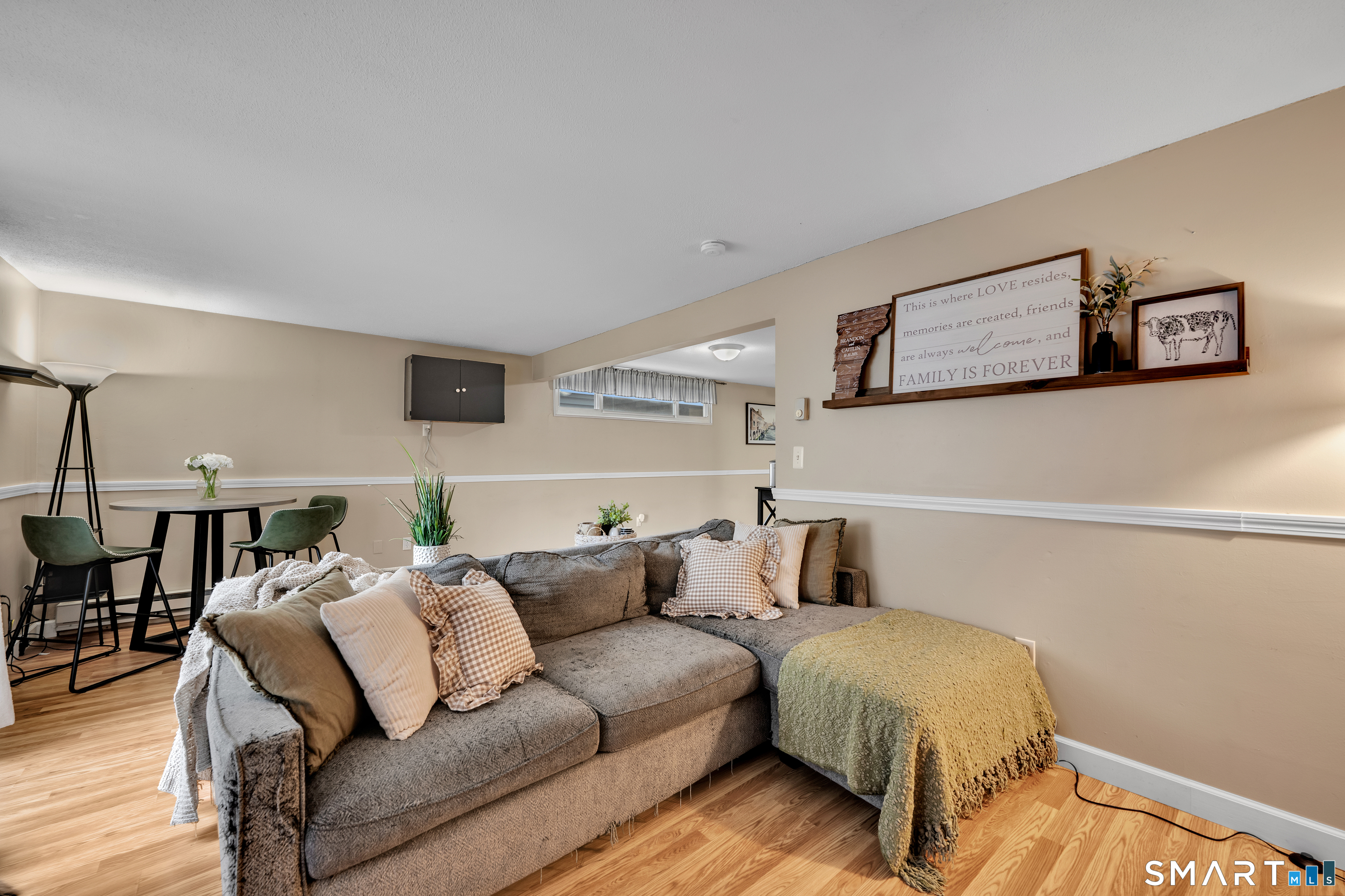 56 Cinnamon Spring, Unit 56 South Windsor, CT 06074 - Photo 8 of 31 a living room with furniture and a lamp