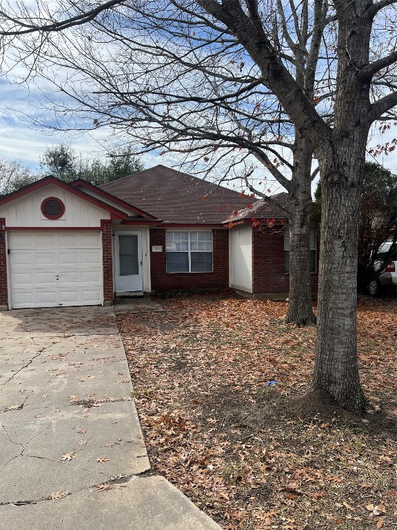 208 Jan Lane Georgetown, TX 78626 - Photo 1 of 21 a front view of a house with a yard