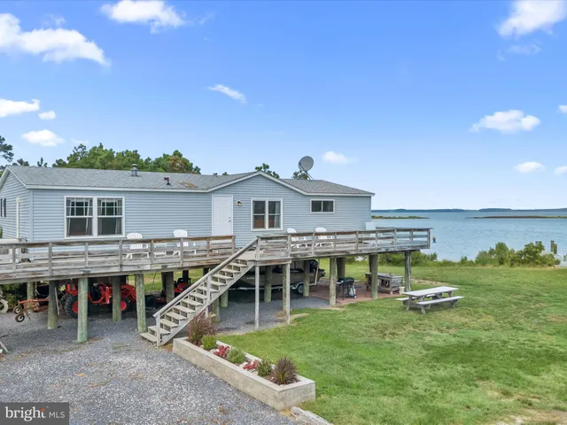 a aerial view of a house with swimming pool and porch