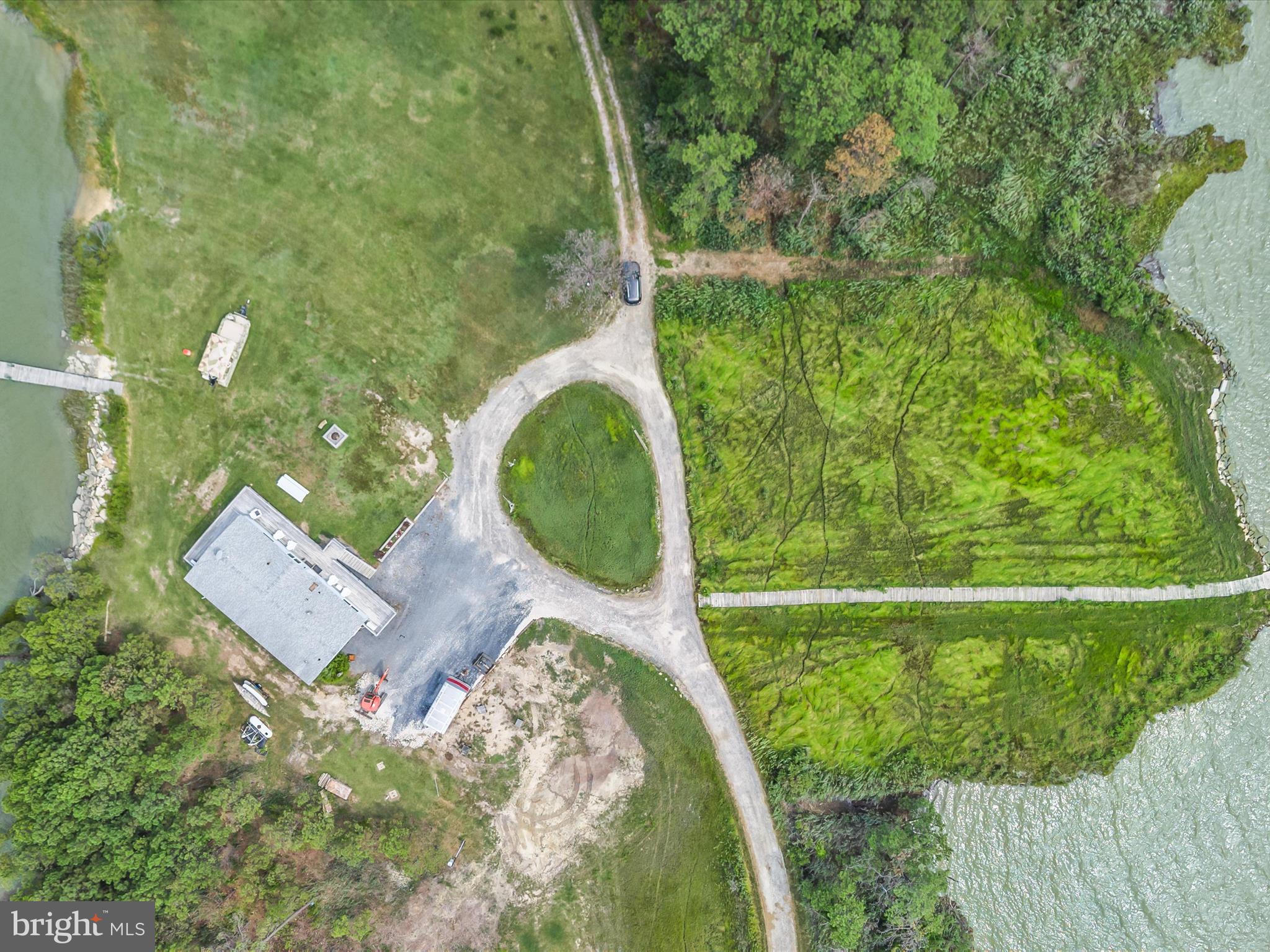 2765 Hoopers Island Road Fishing Creek, MD 21634 - Photo 11 of 111 a aerial view of a house with a yard and lake view