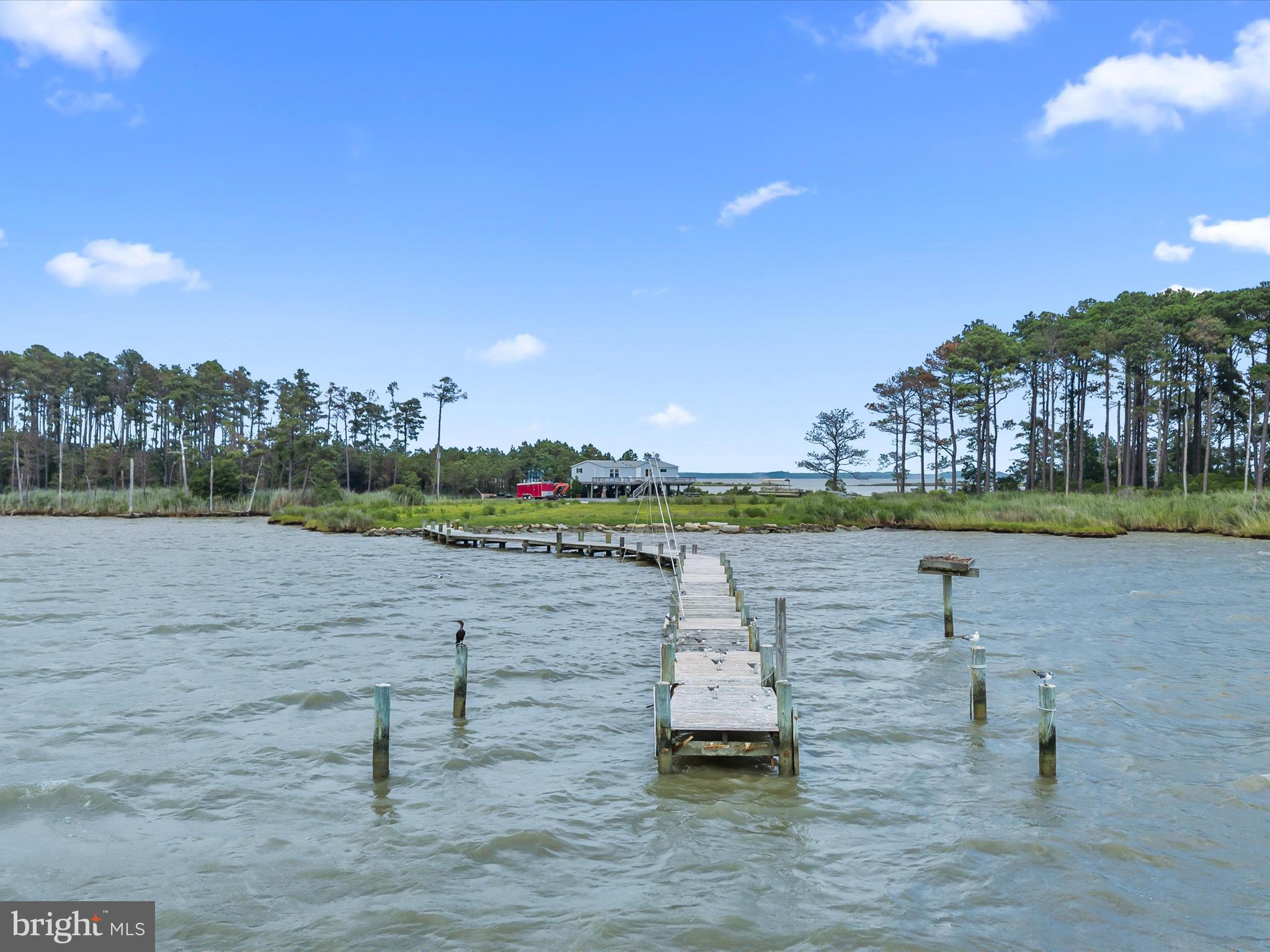 2765 Hoopers Island Road Fishing Creek, MD 21634 - Photo 13 of 111 a view of a lake with houses in the background