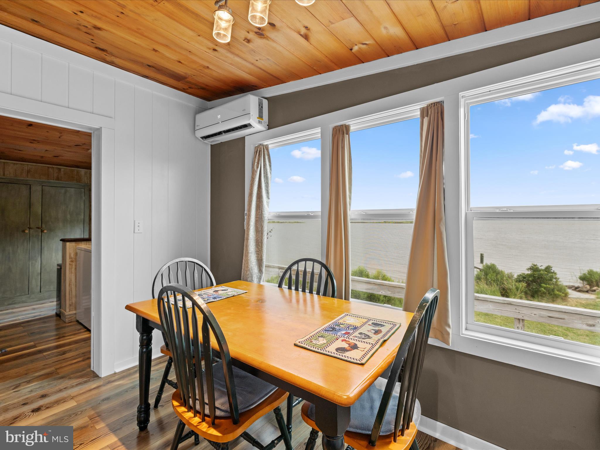 2765 Hoopers Island Road Fishing Creek, MD 21634 - Photo 23 of 111 a view of a dining room with furniture window and wooden floor