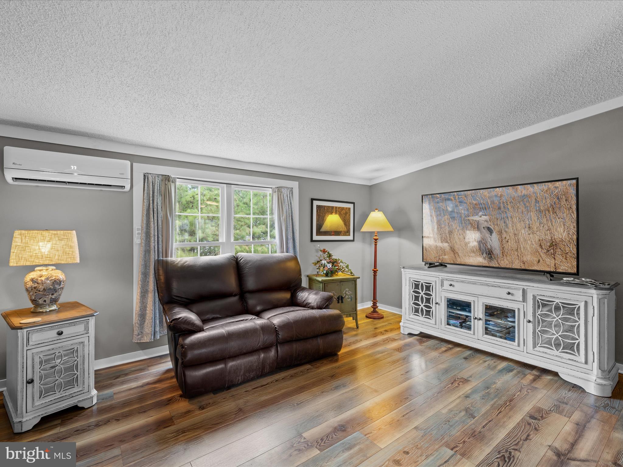 2765 Hoopers Island Road Fishing Creek, MD 21634 - Photo 26 of 111 a living room with furniture and a flat screen tv