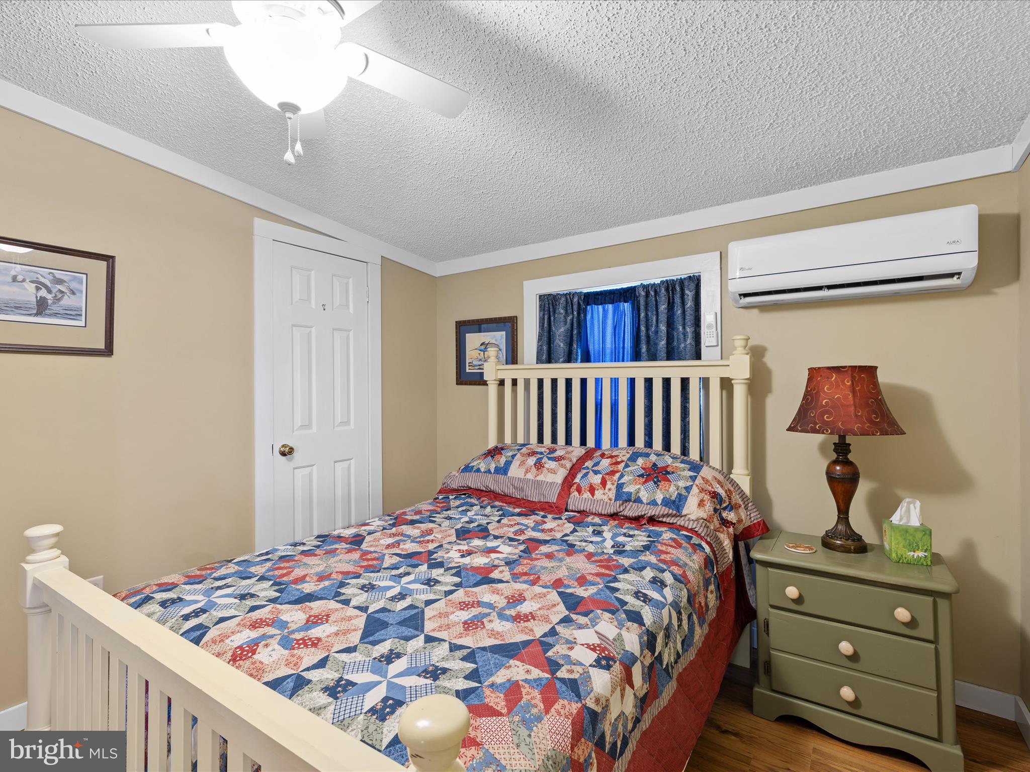 2765 Hoopers Island Road Fishing Creek, MD 21634 - Photo 33 of 111 a bedroom with a bed and wooden floor