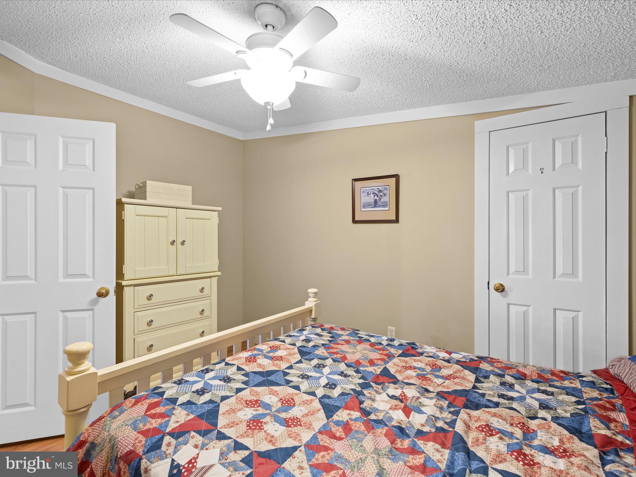 2765 Hoopers Island Road Fishing Creek, MD 21634 - Photo 35 of 111 a bedroom with a bed and a dresser